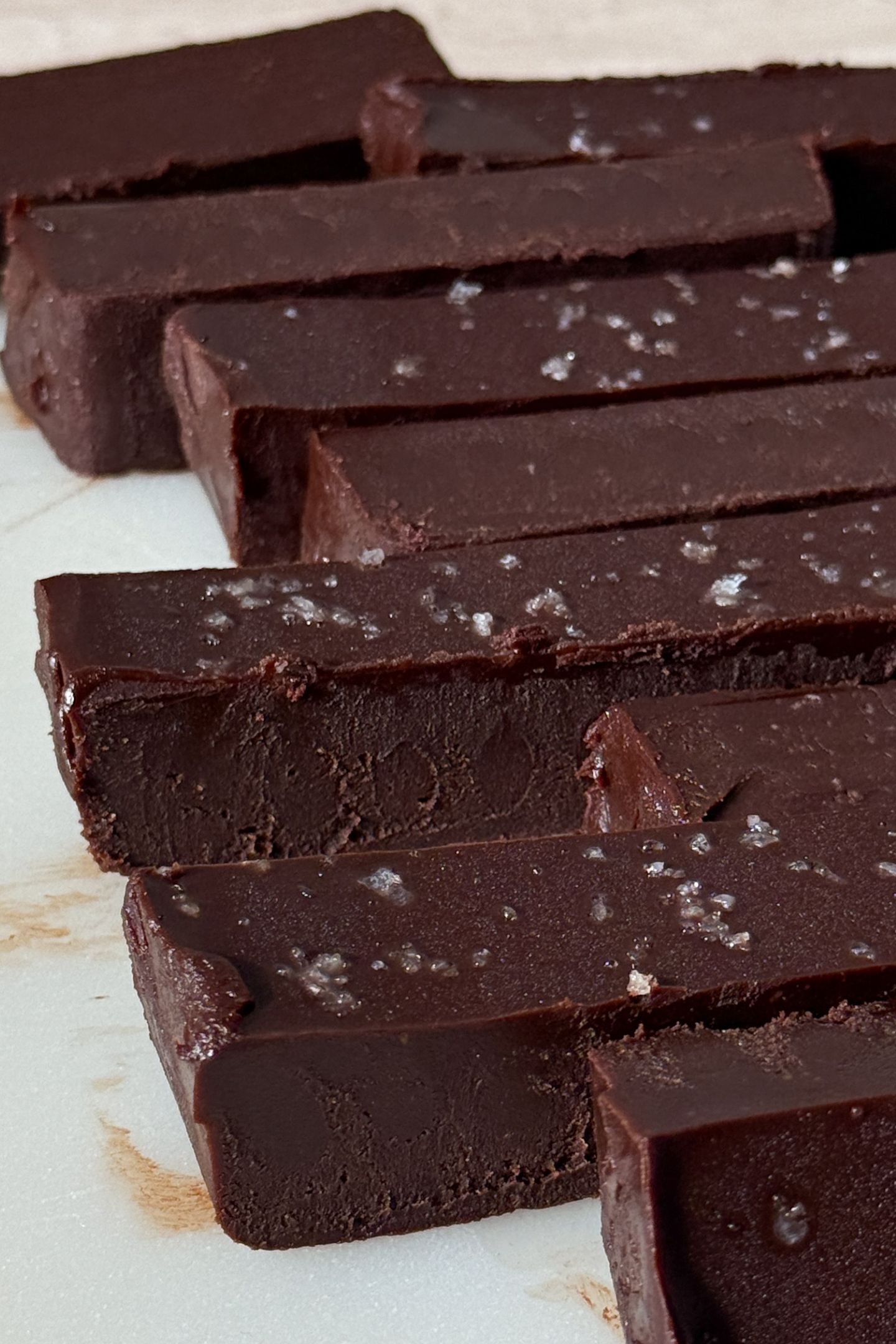 Slices of the dark chocolate fudge topped with sea salt flakes.