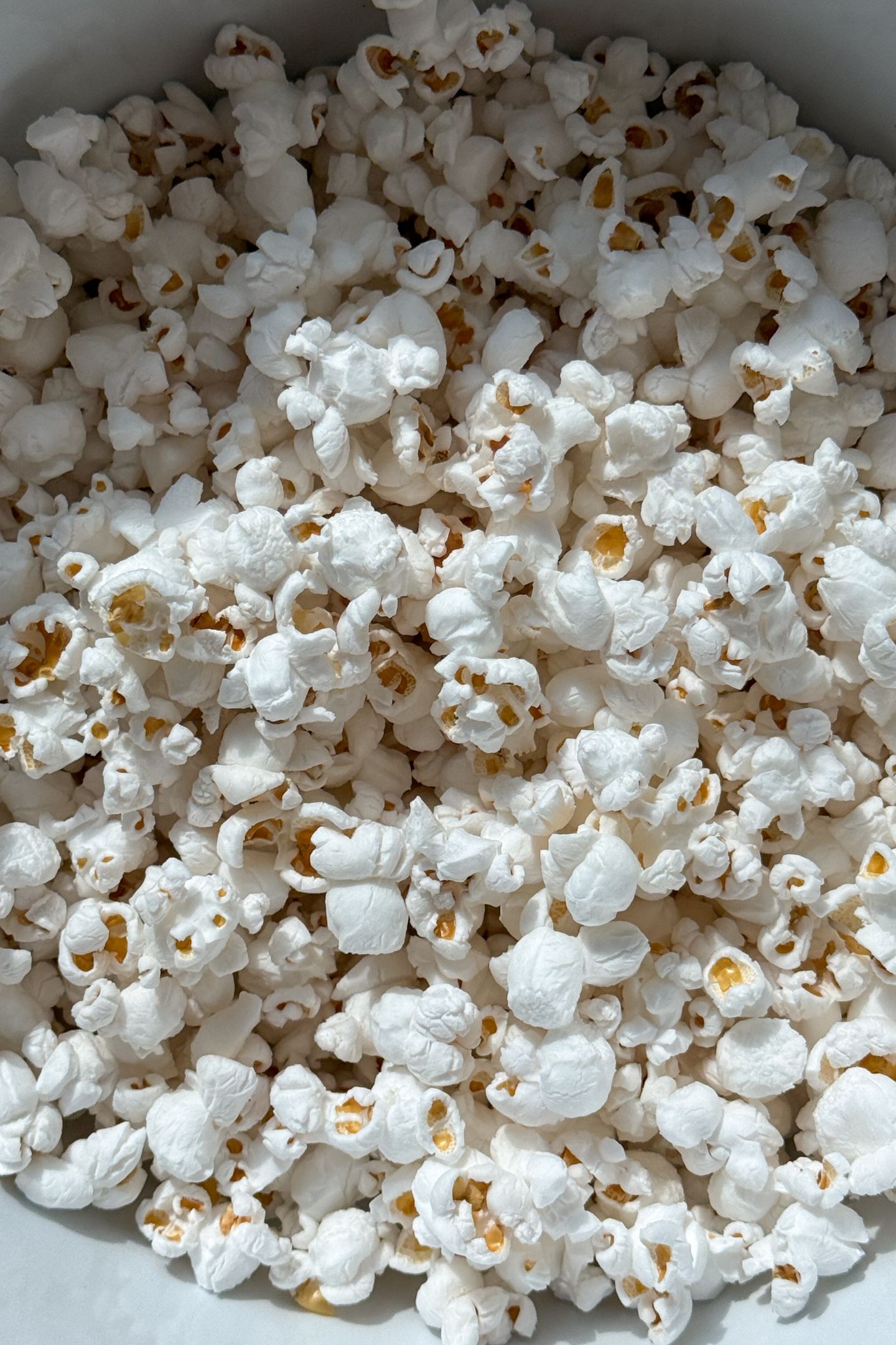 Popped popcorn in a bowl.