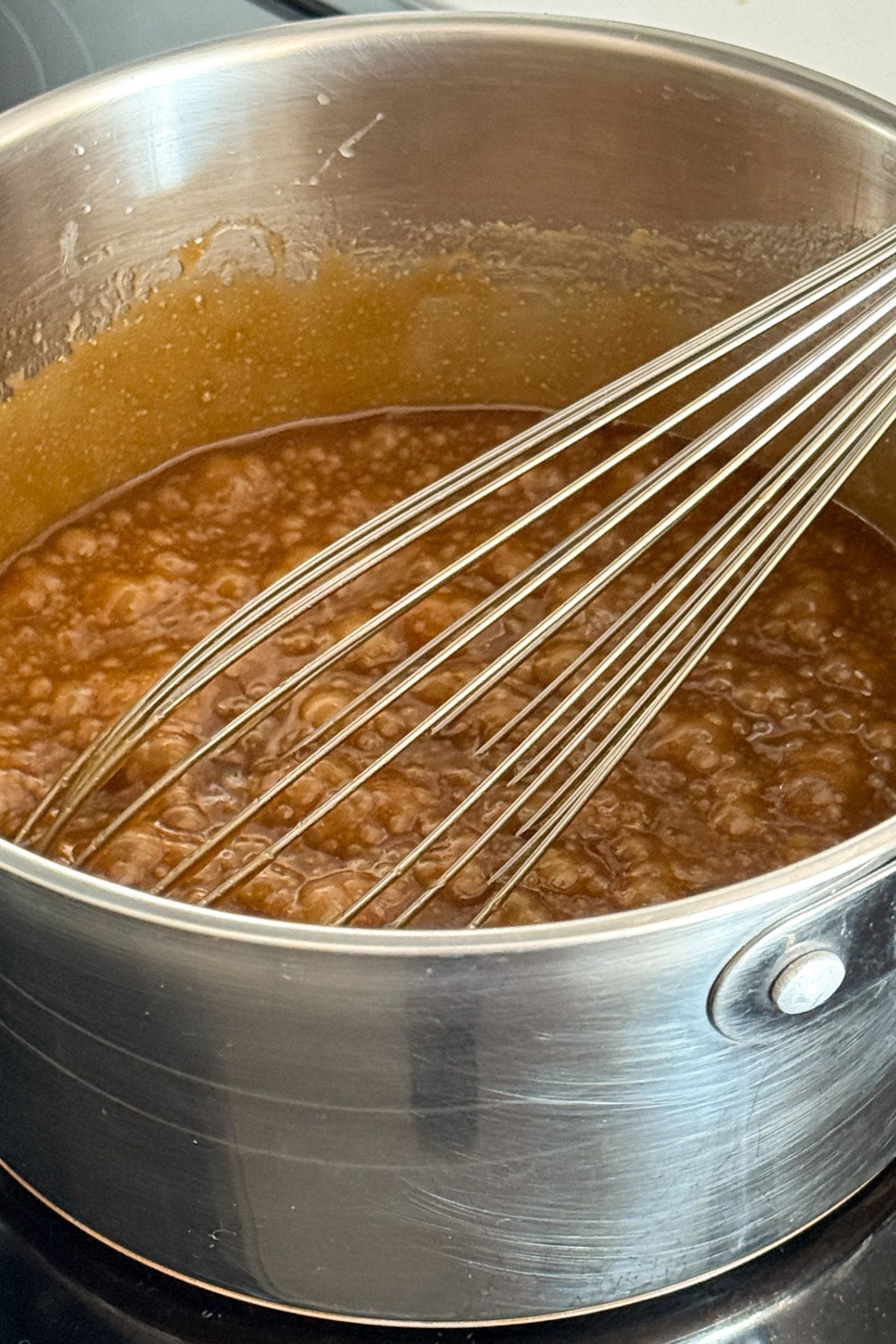 Making caramel sauce in a pot.