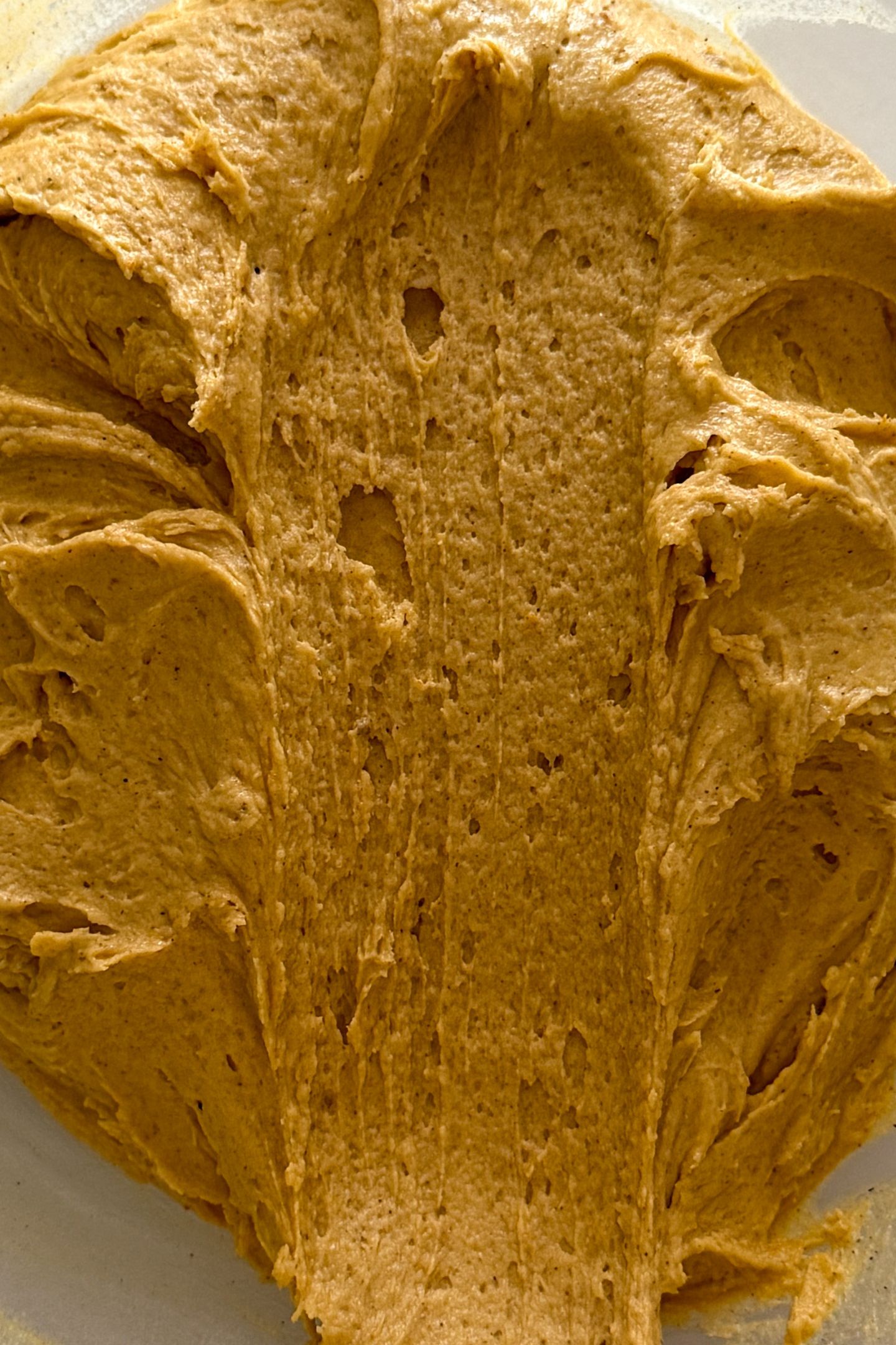 Scooping the cookie batter.