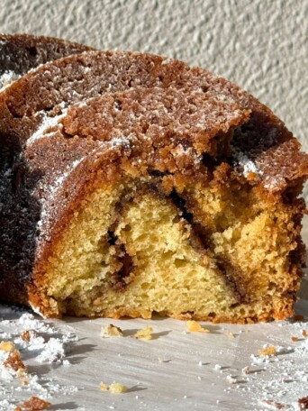 Side view of Coffee Cake Bundt Cake with a cinnamon swirl in the middle.
