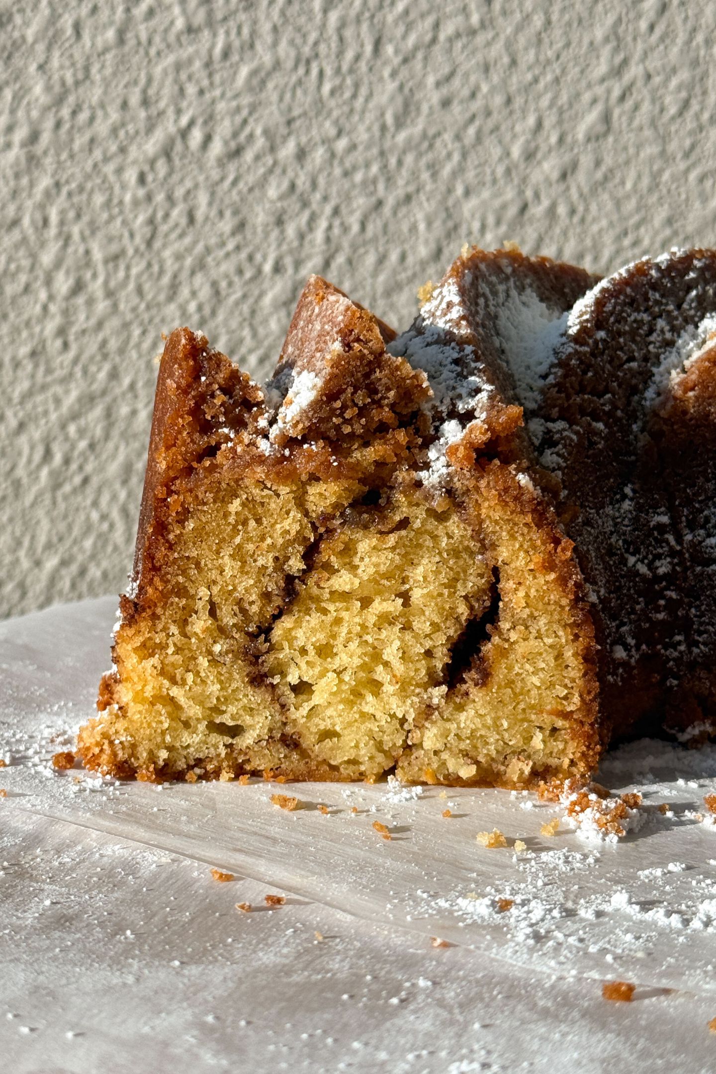 Coffee Cake Bundt Cake with a cinnamon swirl in the middle and crumb topping.