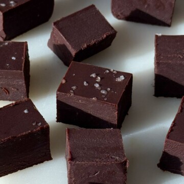 Pieces of dark chocolate fudge on a serving platter.