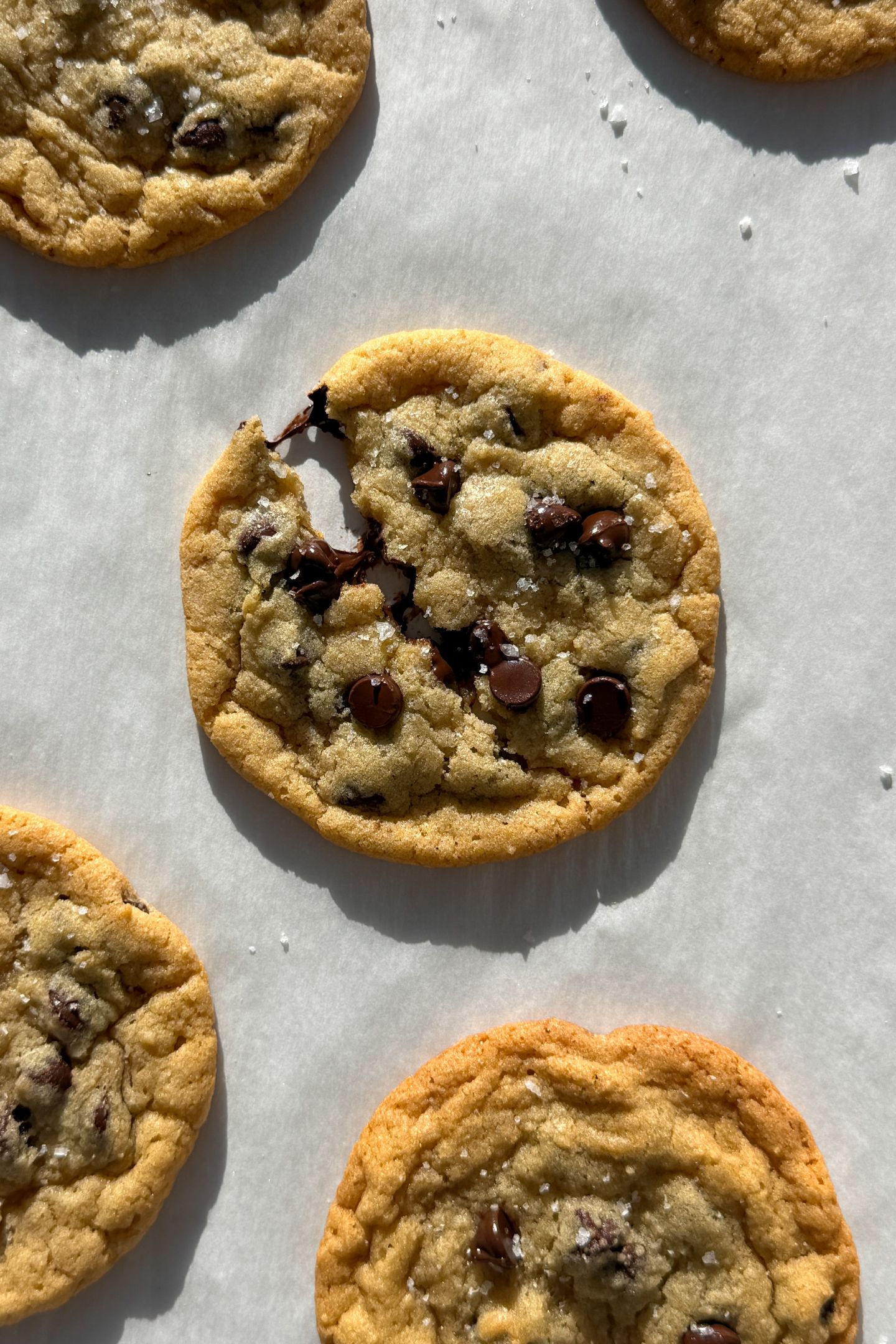 Birds eye view of a chocolate chip cookie broken in half.
