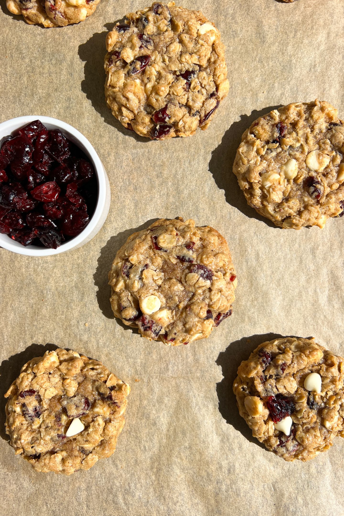 White Chocolate Dried Cranberry Oatmeal Cookies on a baking sheet lined with parchment paper.