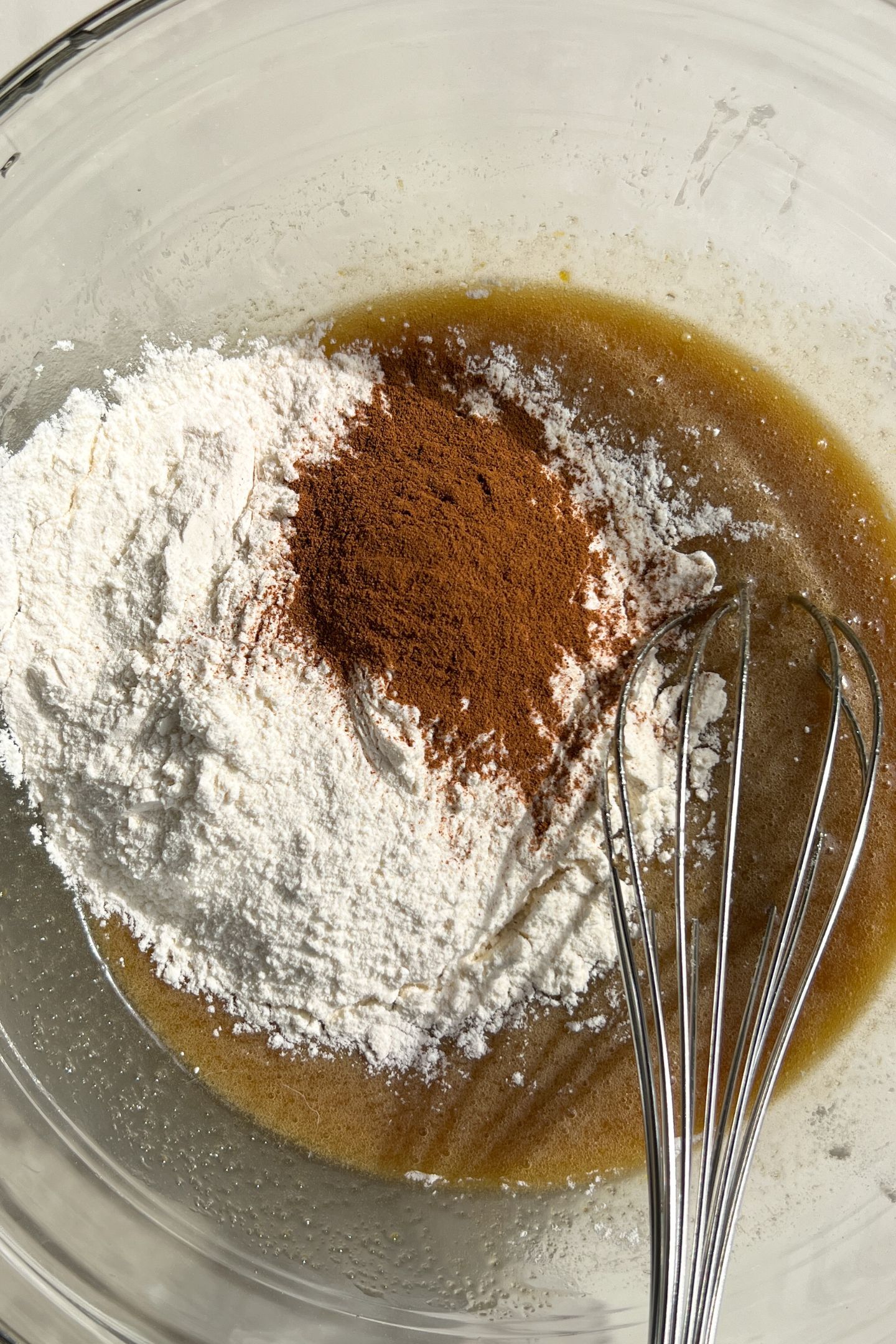 Adding dry ingredients to the wet.