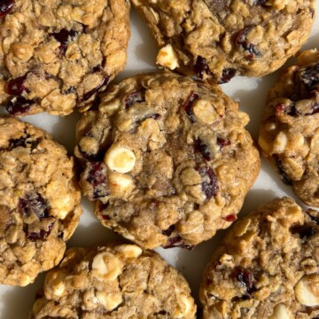 Close up photo to show the white chocolate and dried cranberries in the oatmeal cookies.