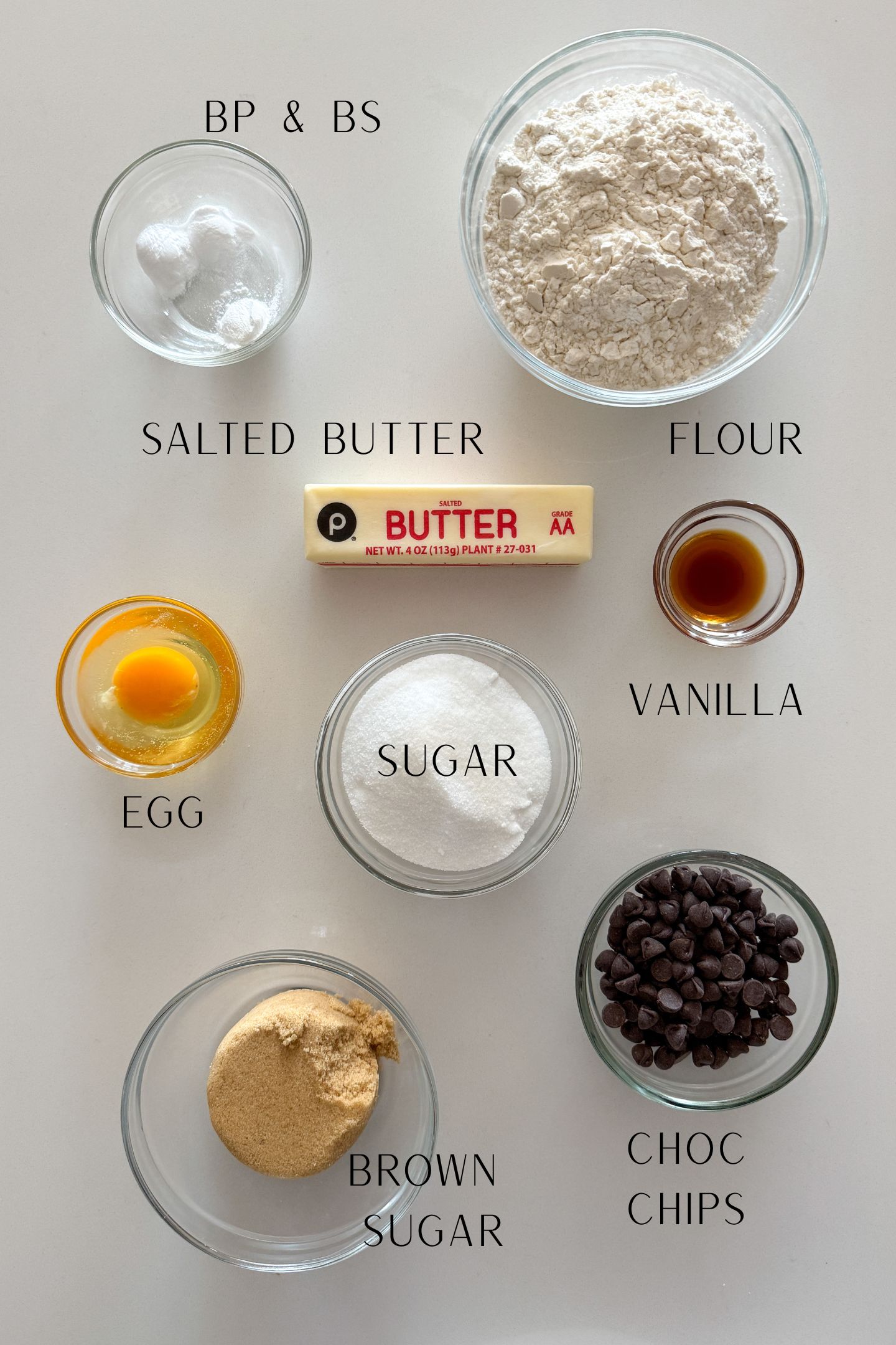 Ingredients measured out in bowls to make thin chocolate chip cookies.