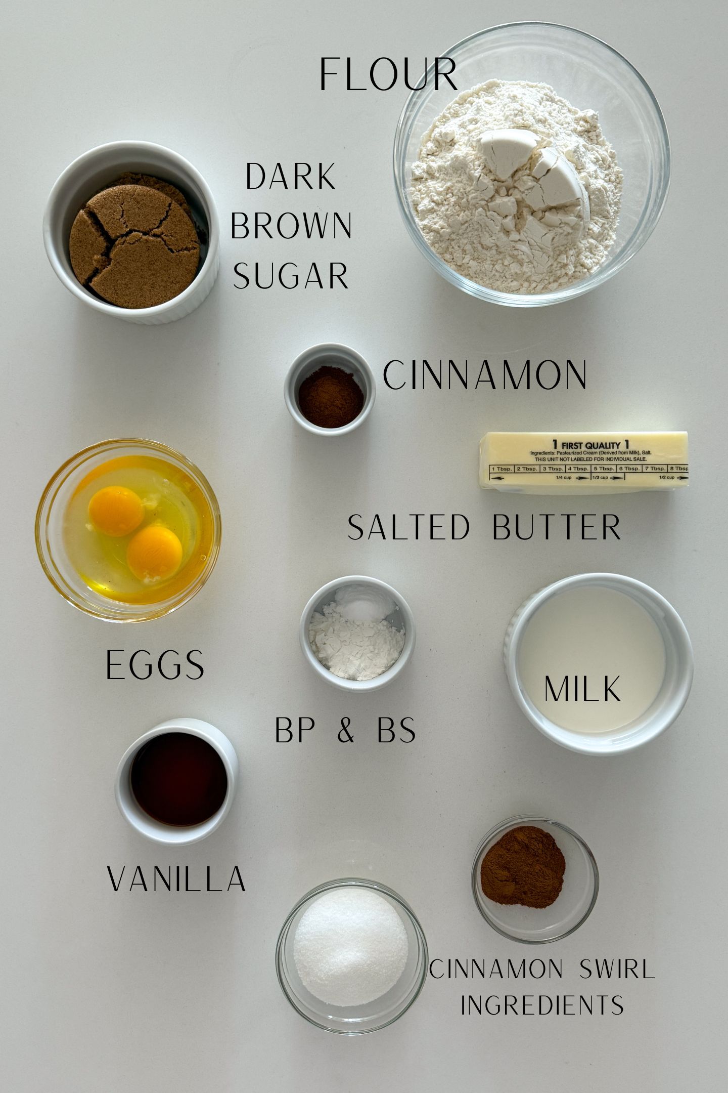Ingredients measured out in bowls to make the cinnamon streusel muffin recipe.