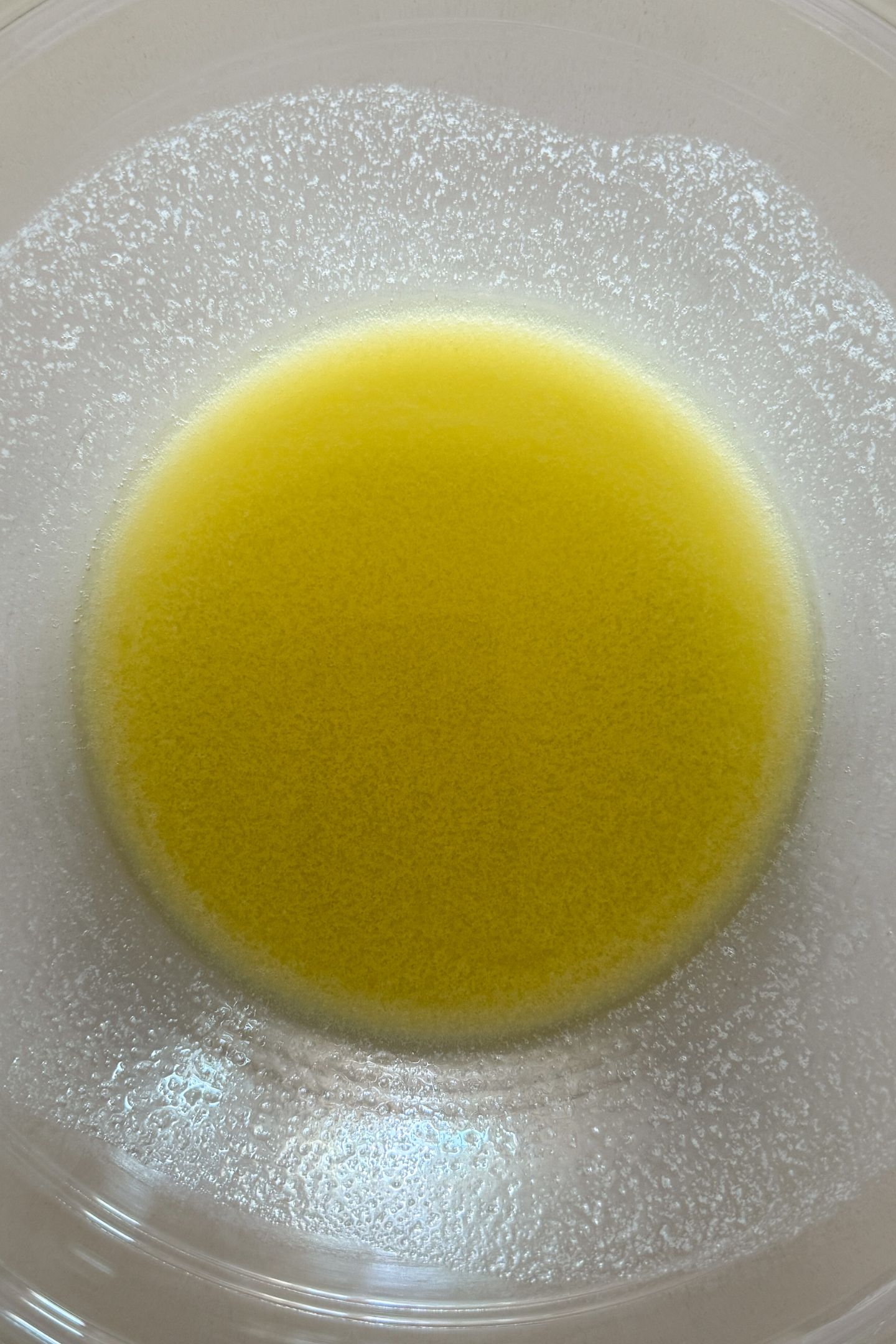 Salted butter melted in a bowl.
