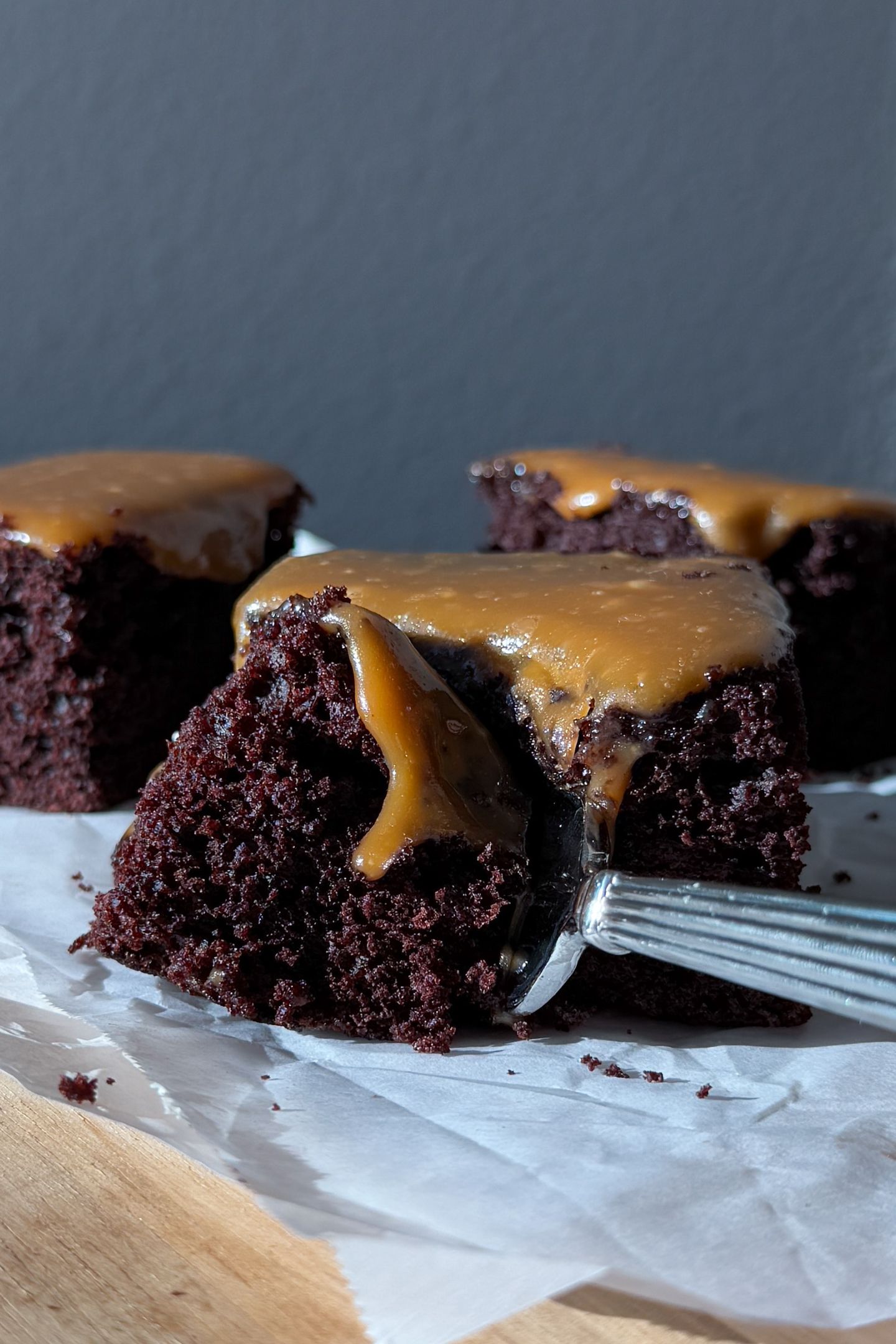 Eating a slice of the salted caramel chocolate cake.