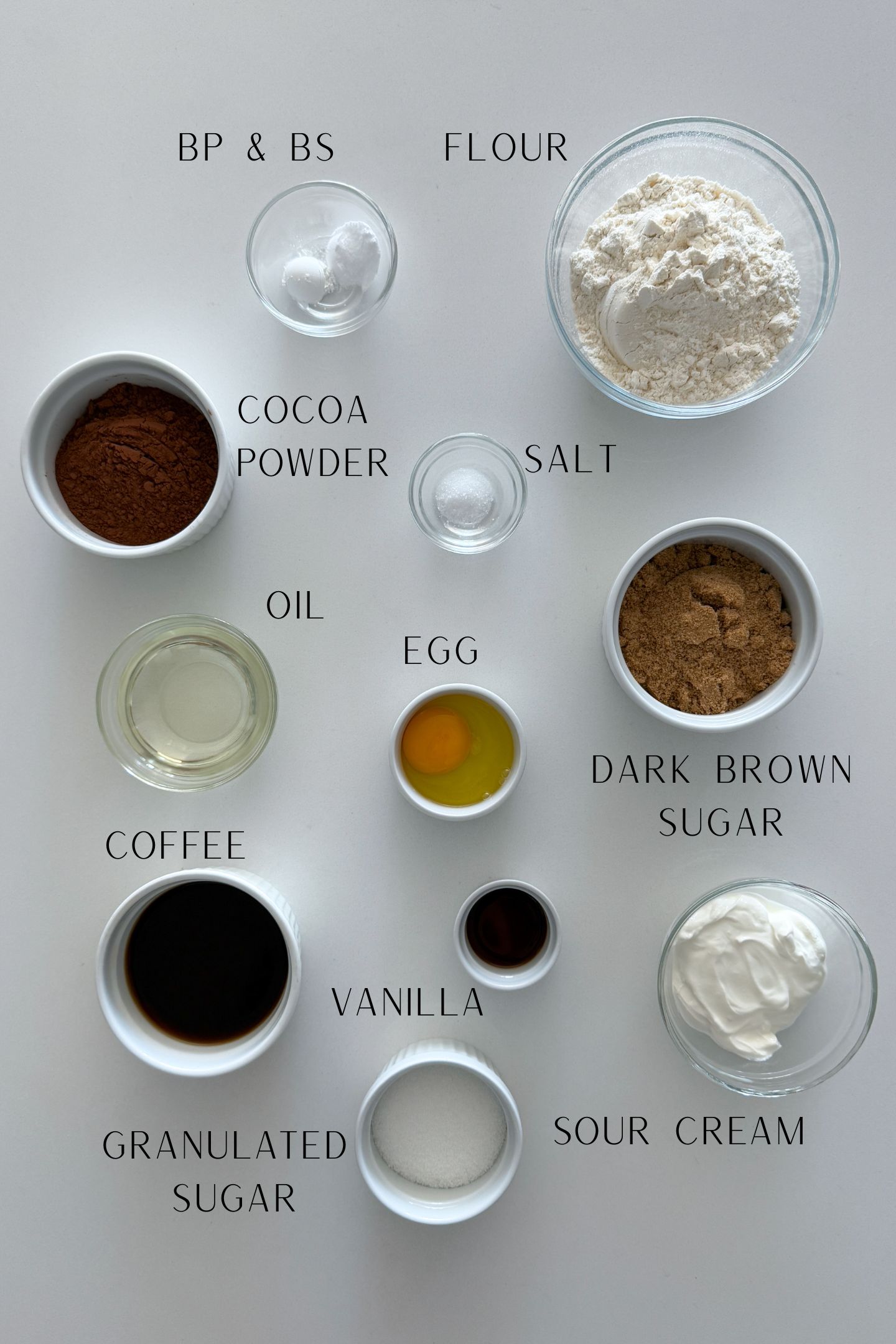 Ingredients measured out in bowls to make the salted caramel chocolate cake.