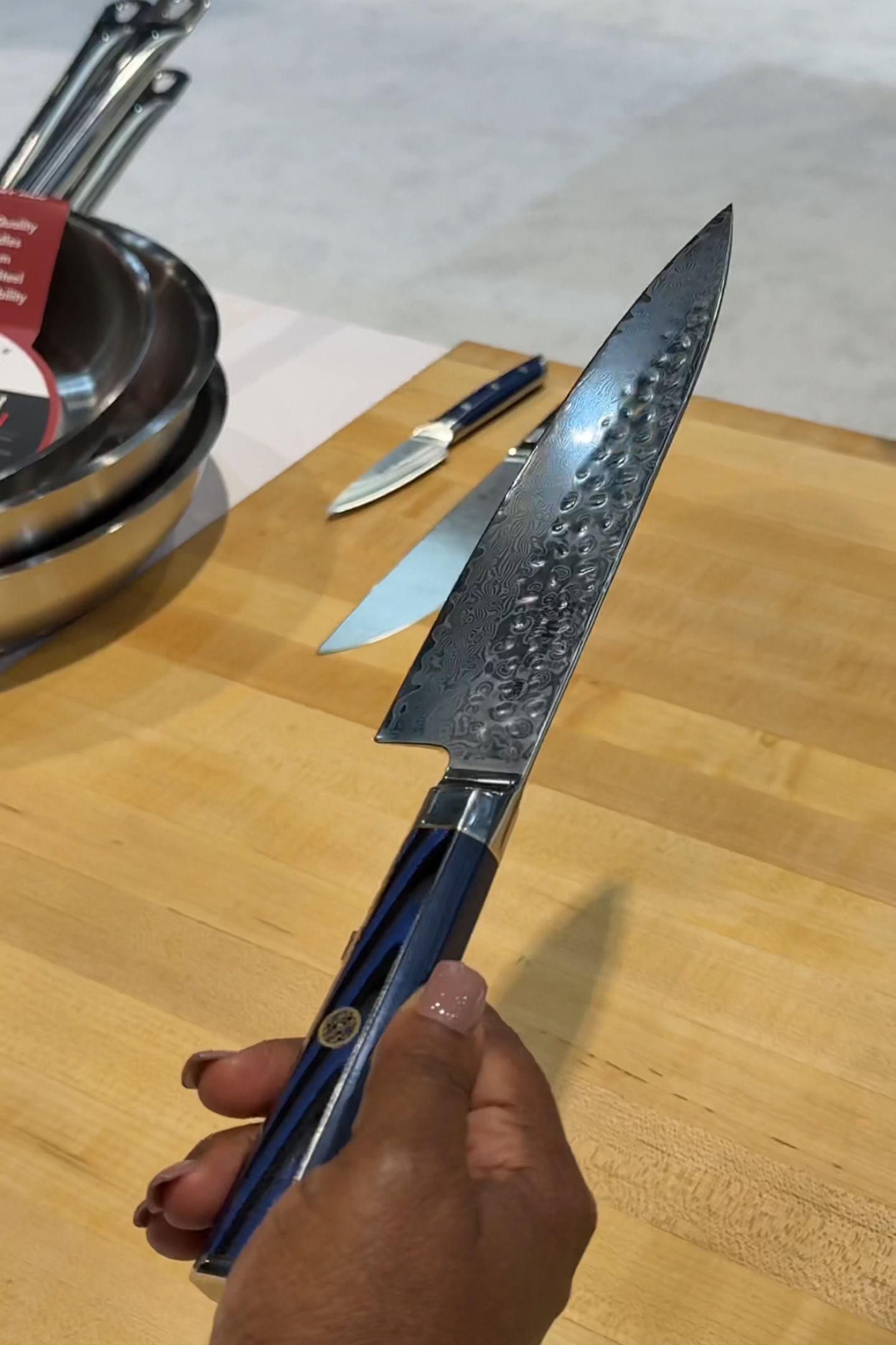 Holding a Cangshan knife in hand.