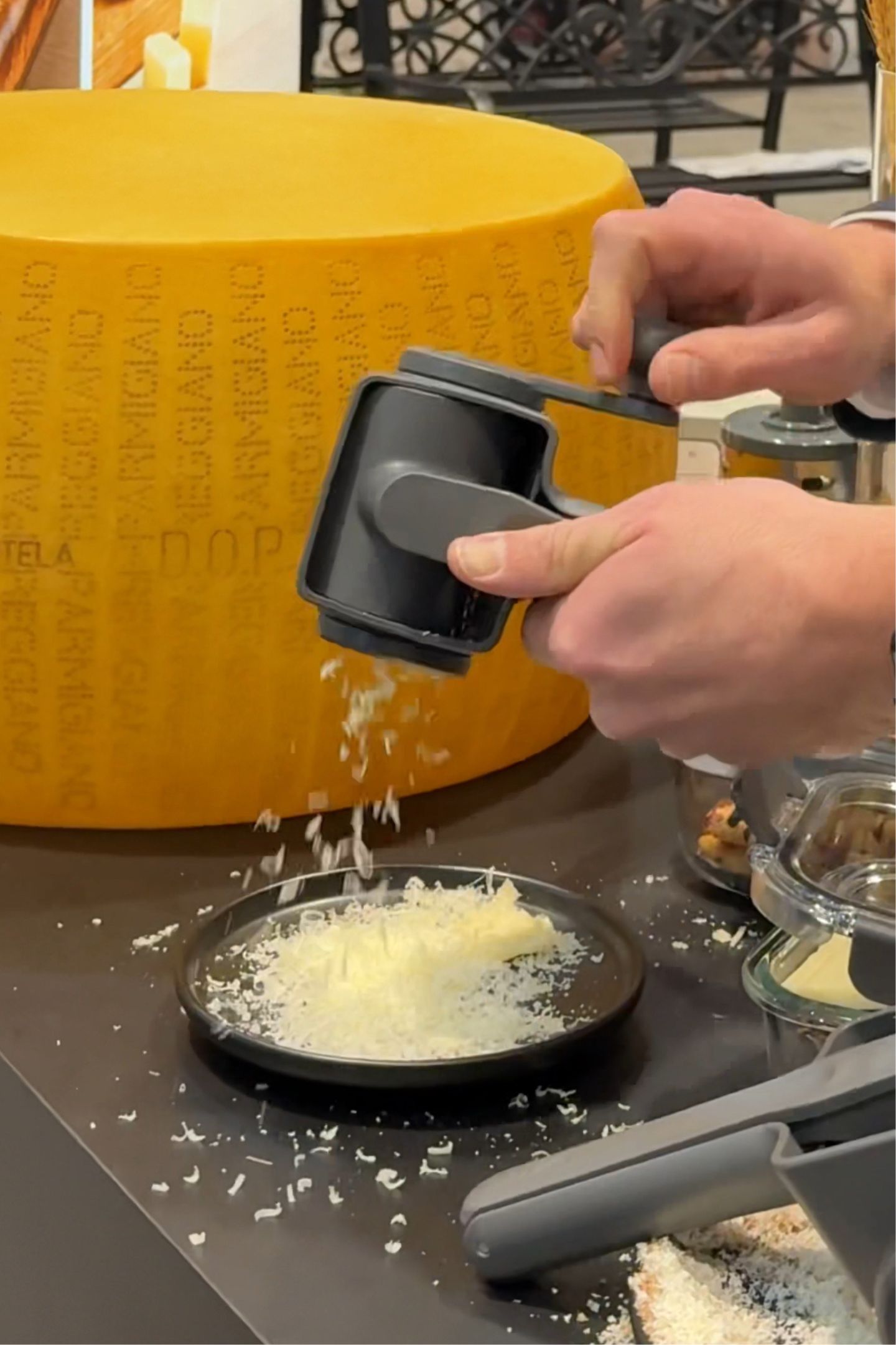 A cheese grater being used.