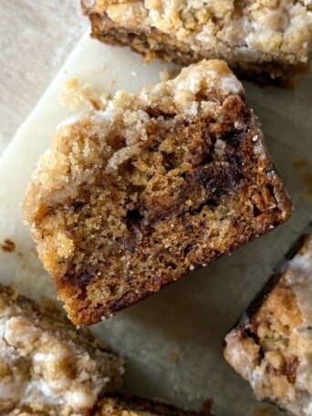 A slice of banana bread coffee cake on its side to show the layers.