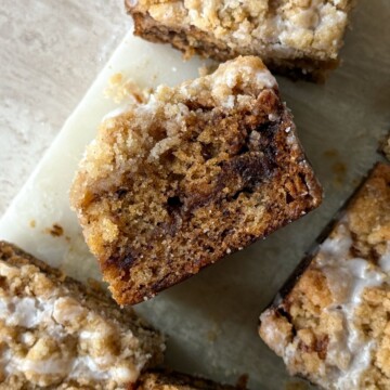 A slice of banana bread coffee cake on its side to show the layers.