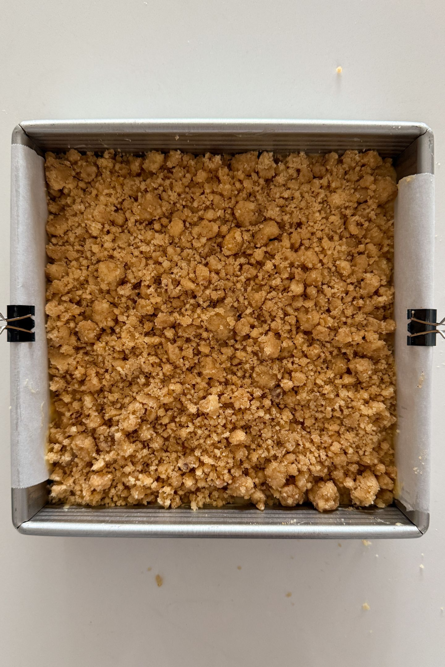 The crumble added on top of the batter.