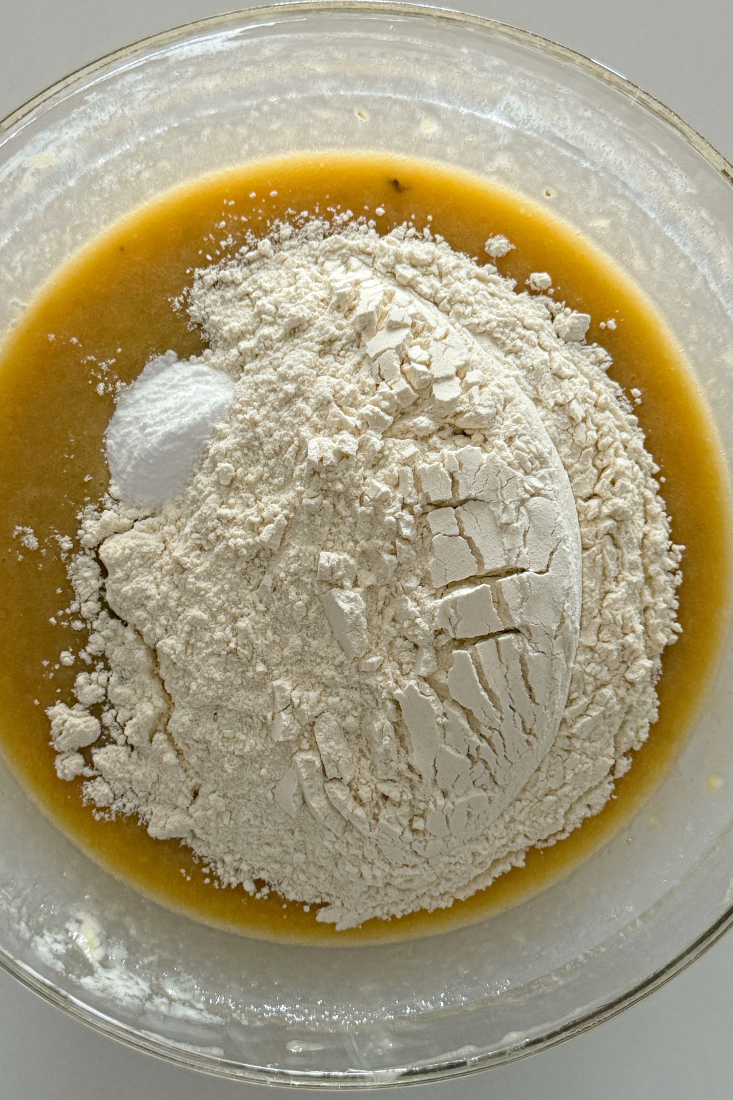 Flour added to bowl with the wet ingredients.