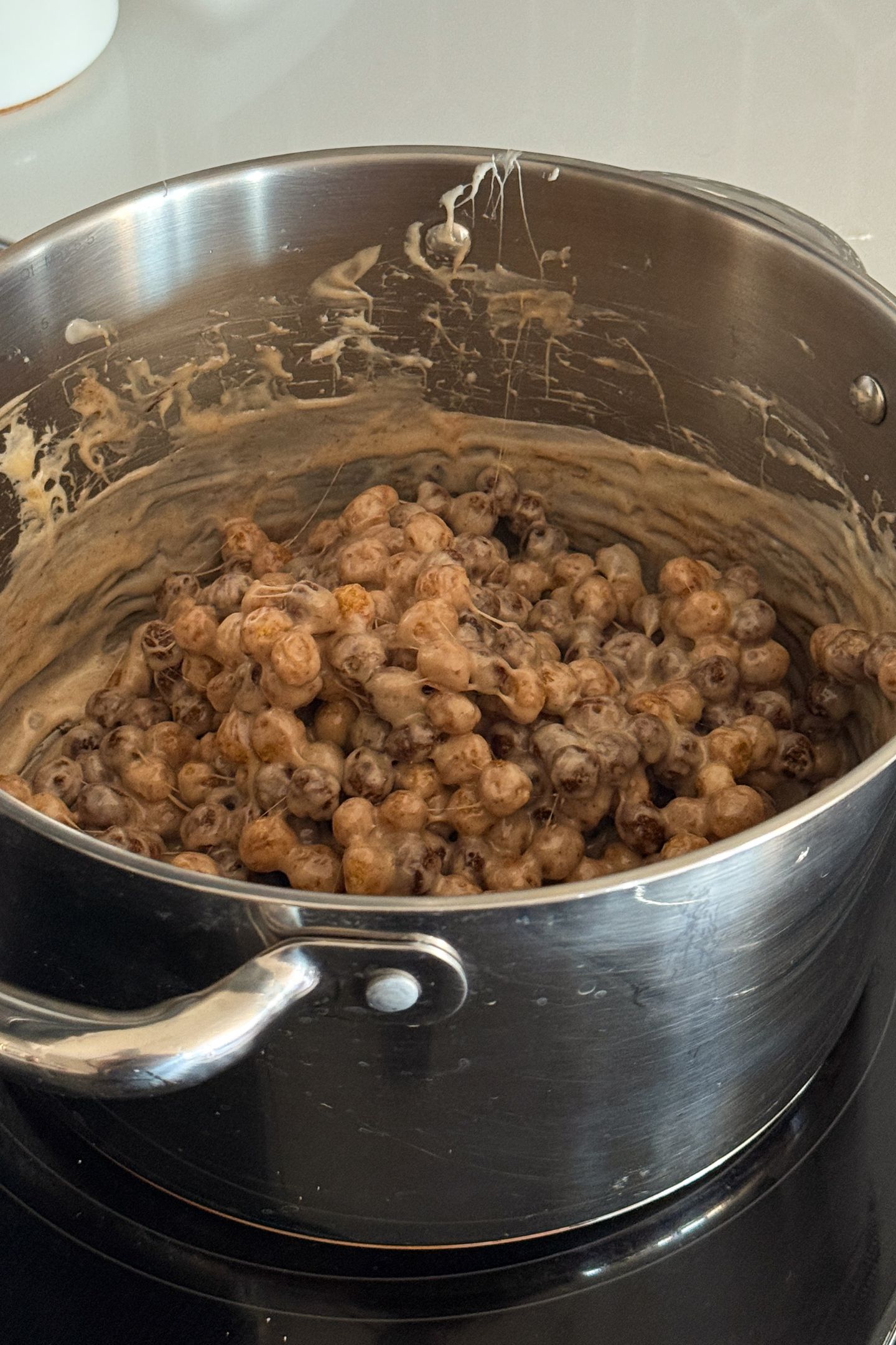 Mix in the cereal with the melted marshmallow.