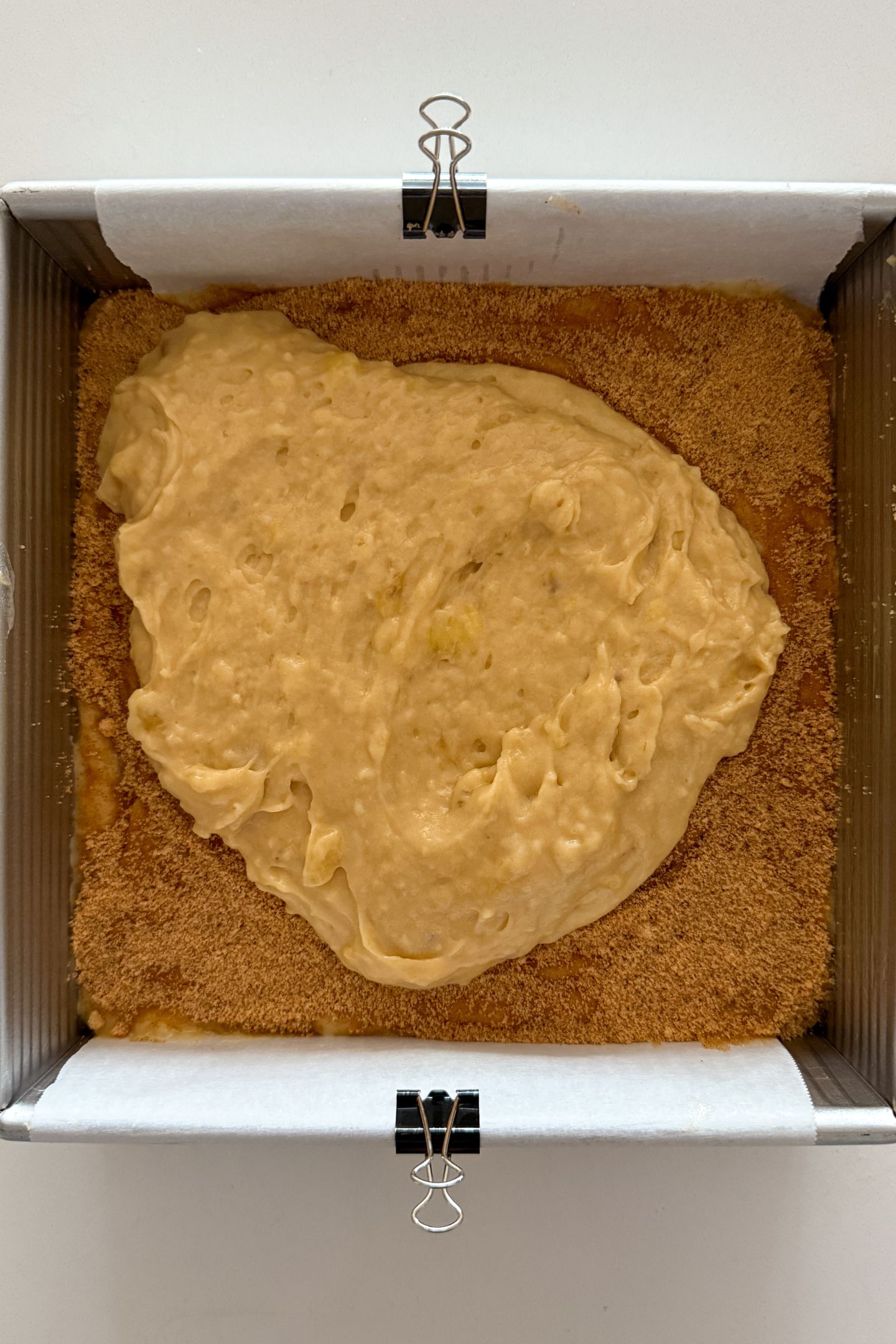 Adding the rest of the batter on top of the cinnamon sugar layer.
