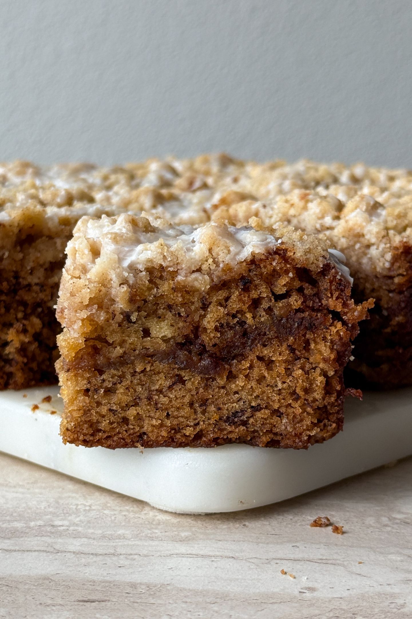 Sliced of banana bread coffee cake on a platter.