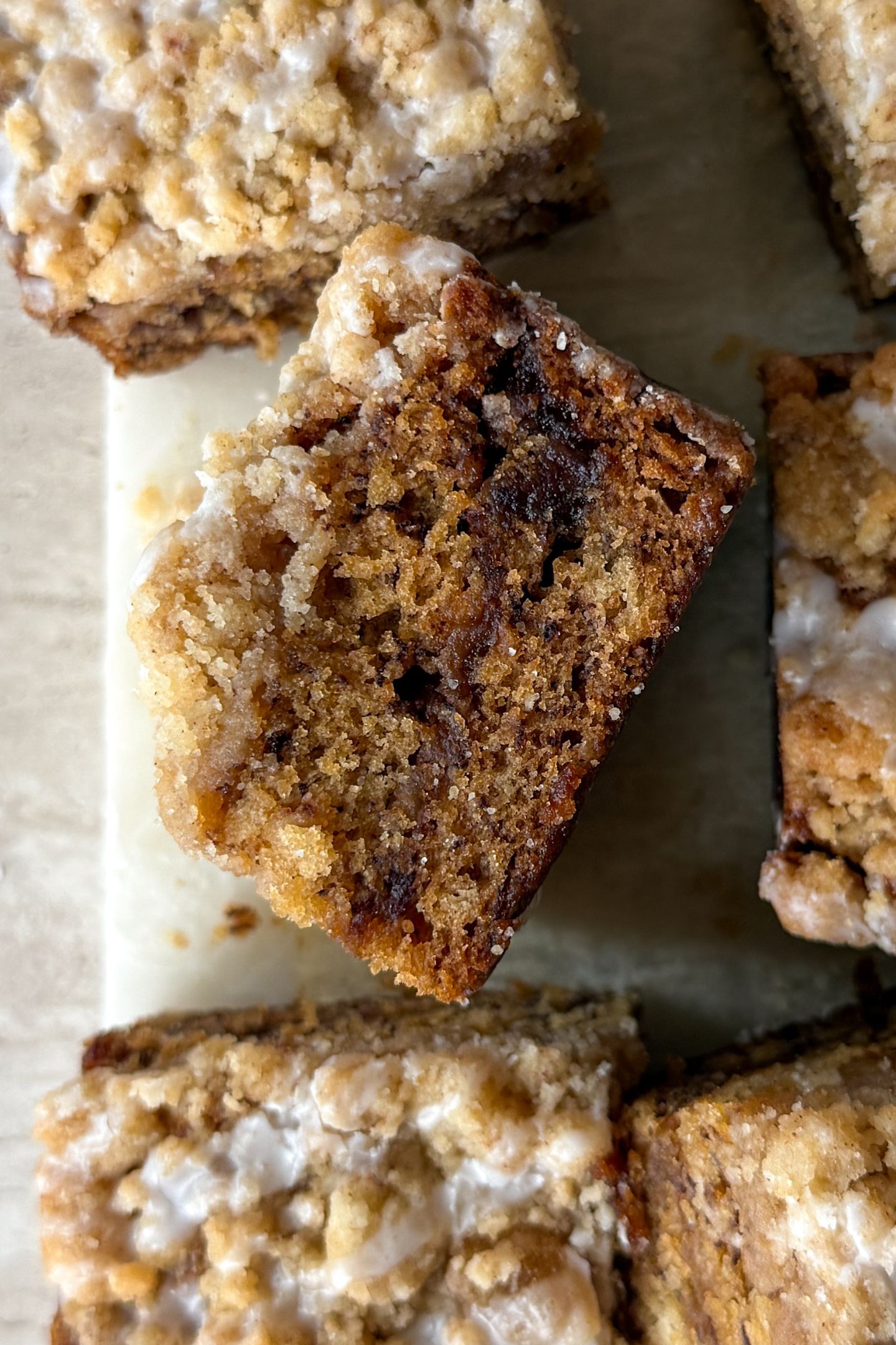 Slice of banana bread coffee cake on its side.