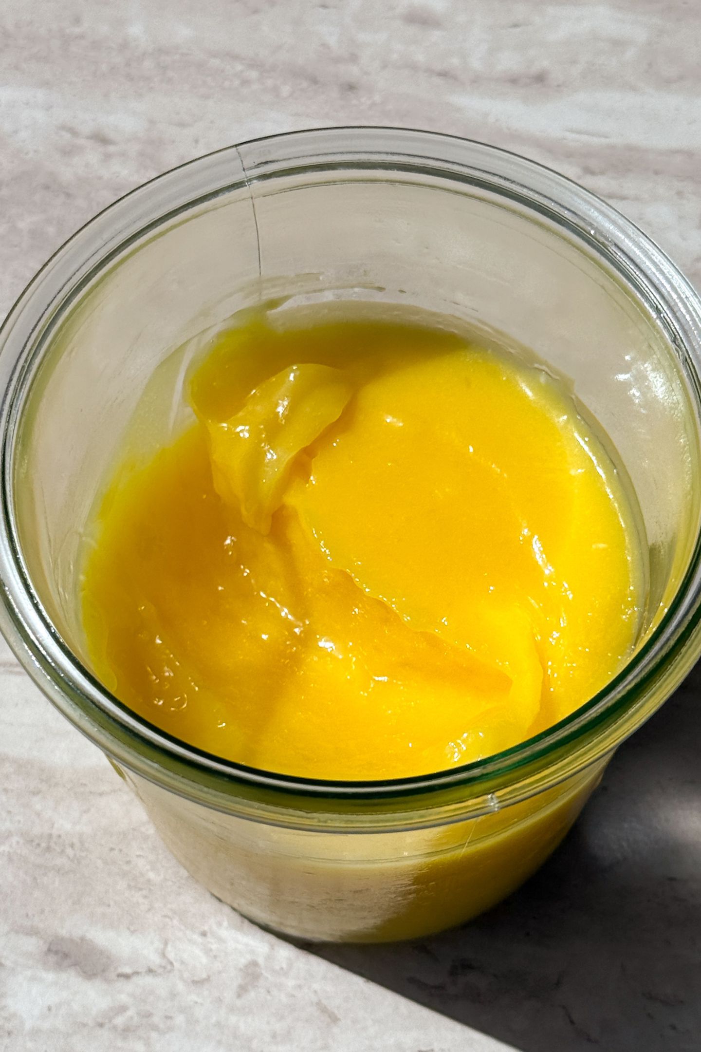 Lemon Curd in a mason jar to be used on cake and cupcakes.