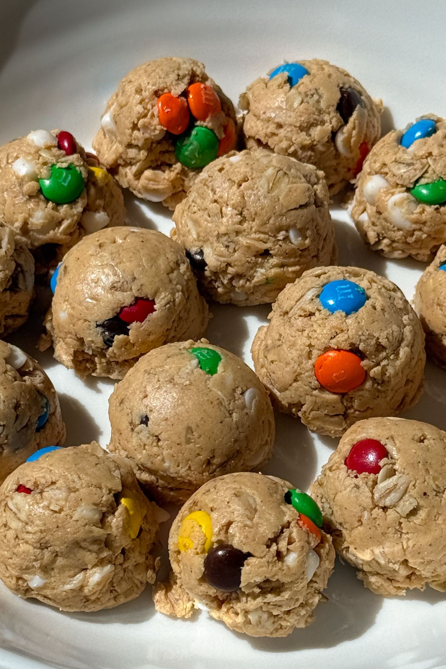 Monster Cookie Dough Protein Balls on a plate.