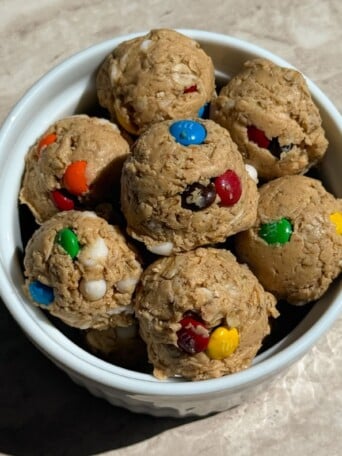 Monster cookie dough protein balls in a bowl.
