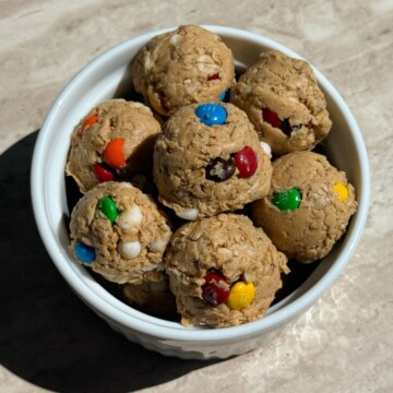 Monster cookie dough protein balls in a bowl.