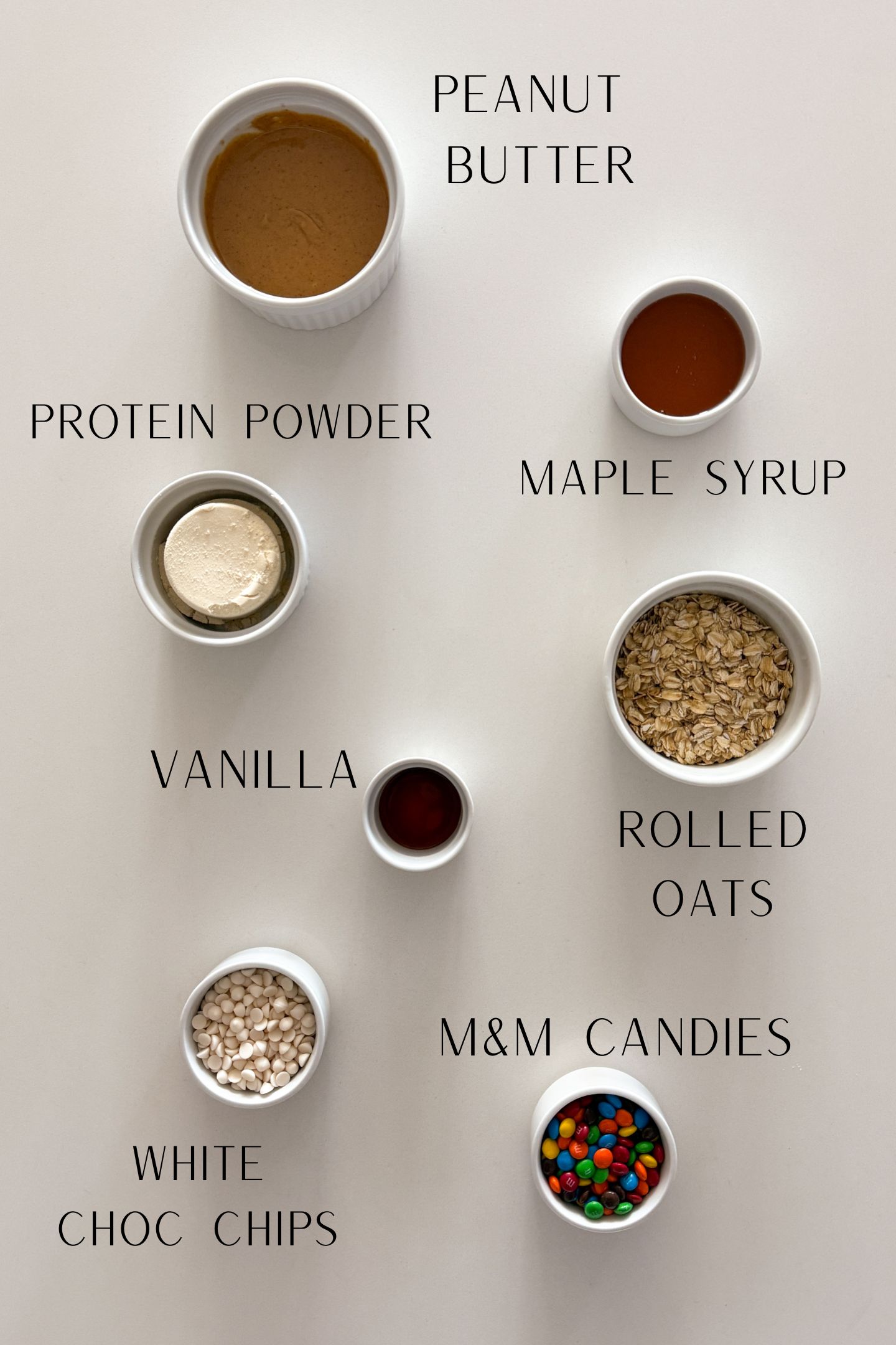 The ingredients measured out in bowls to make the monster cookie protein balls.