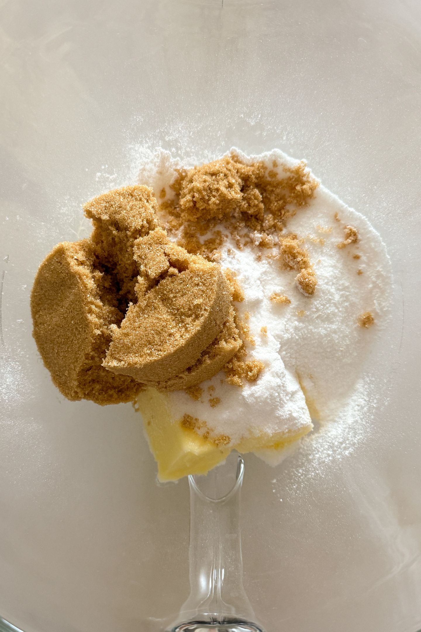 Softened butter in a stand mixer bowl with banana pudding mix and both sugars.