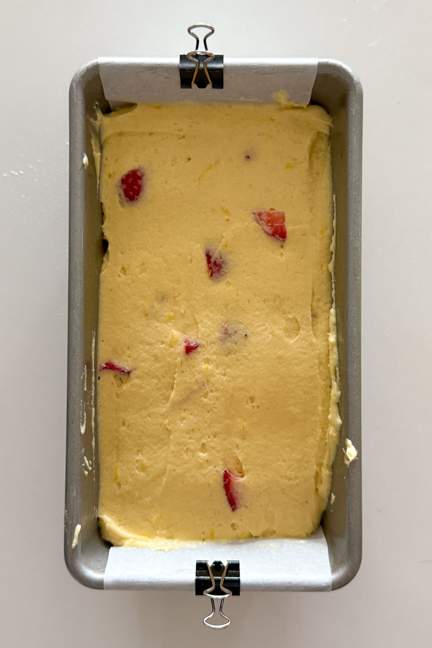 Batter spread in an even layer in the prepared loaf pan.