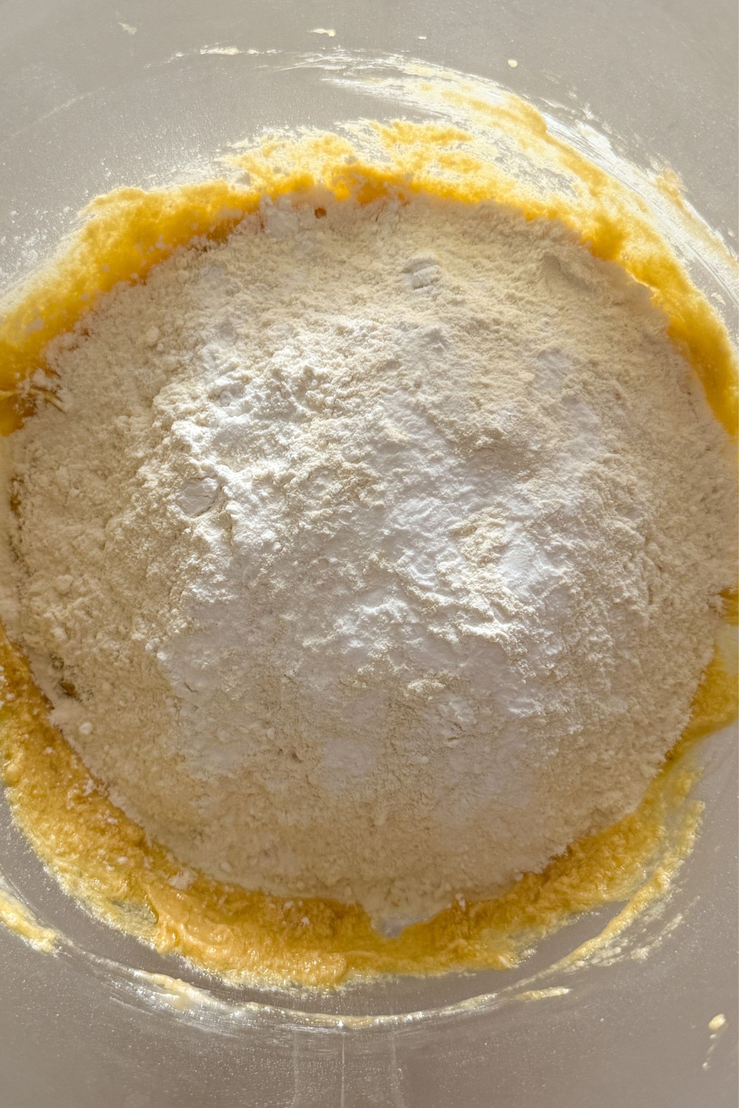 Adding the flour, baking powder and baking soda to the wet ingredients.