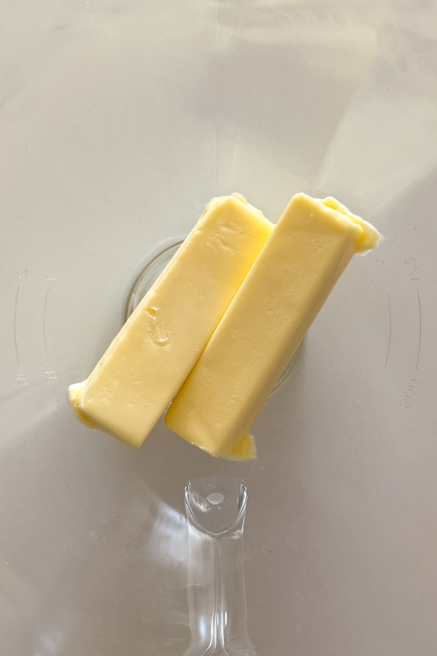 Salted butter softened in a mixing bowl for a stand mixer.