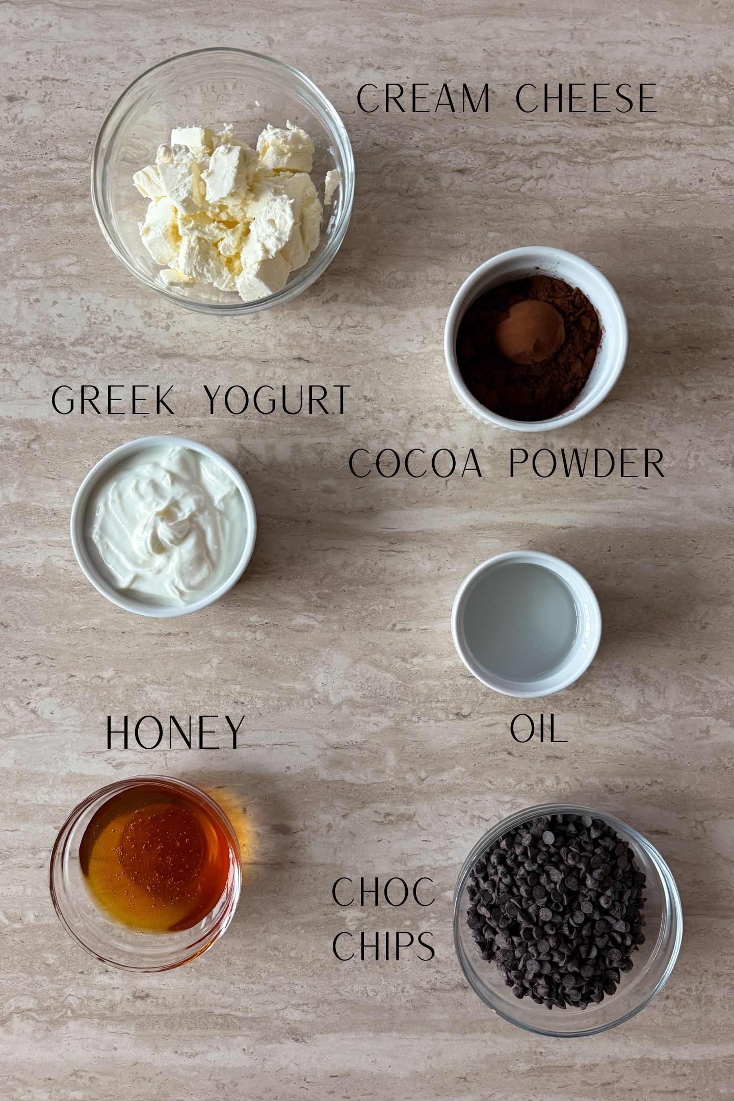 Ingredients measured out in bowls to make the frozen chocolate cheesecake bites.