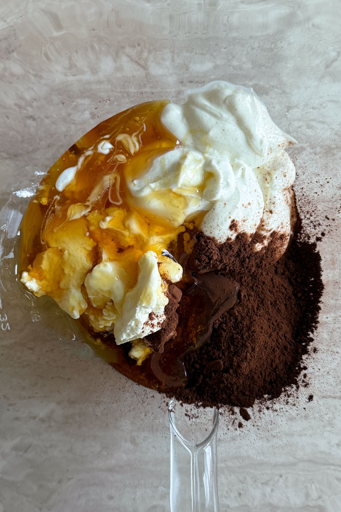 Cream Cheese, Cocoa Powder, Honey and Greek Yogurt in a mixing bowl.