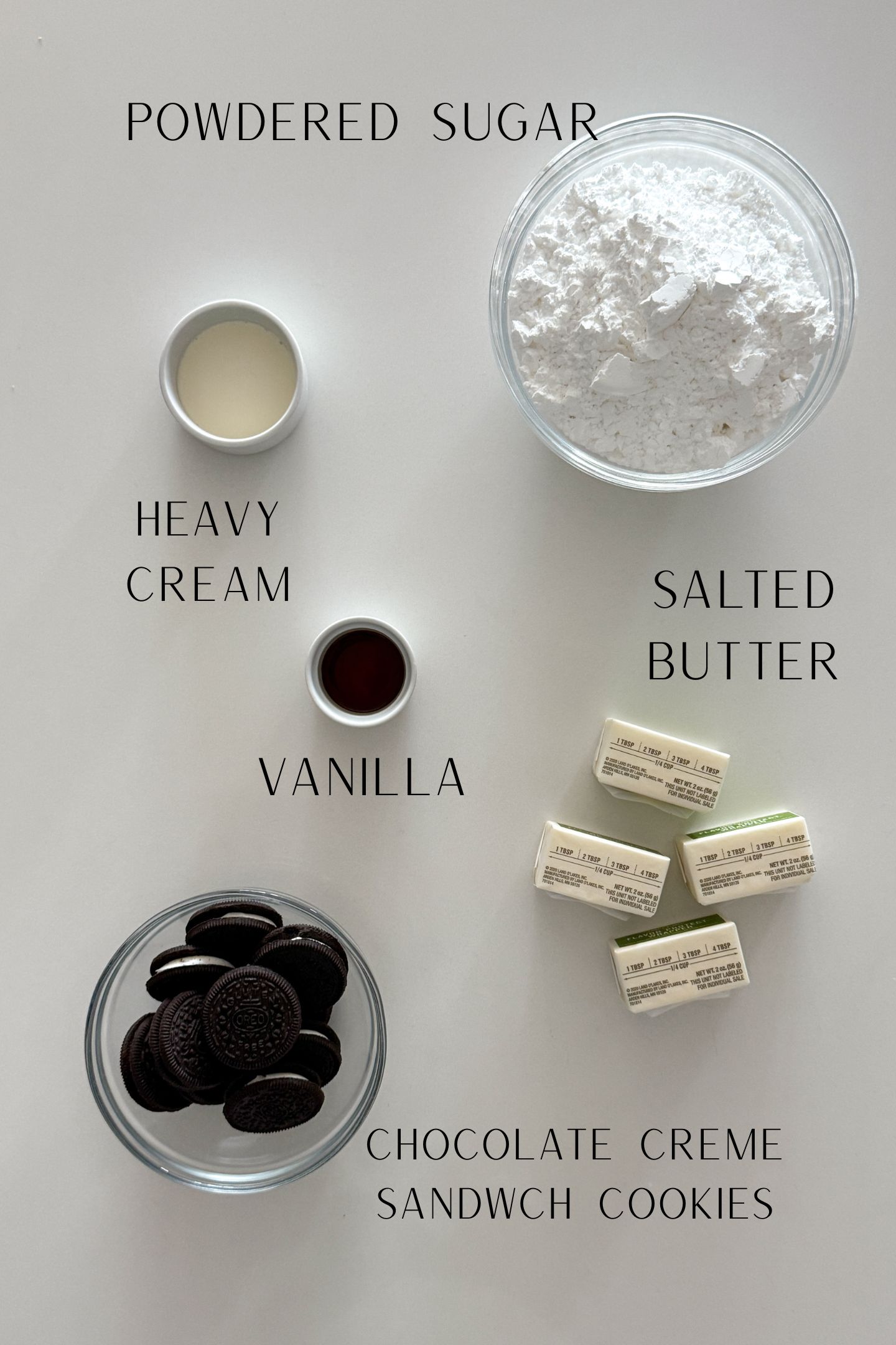 Ingredients measured out in bowls to make the oreo buttercream frosting recipe.