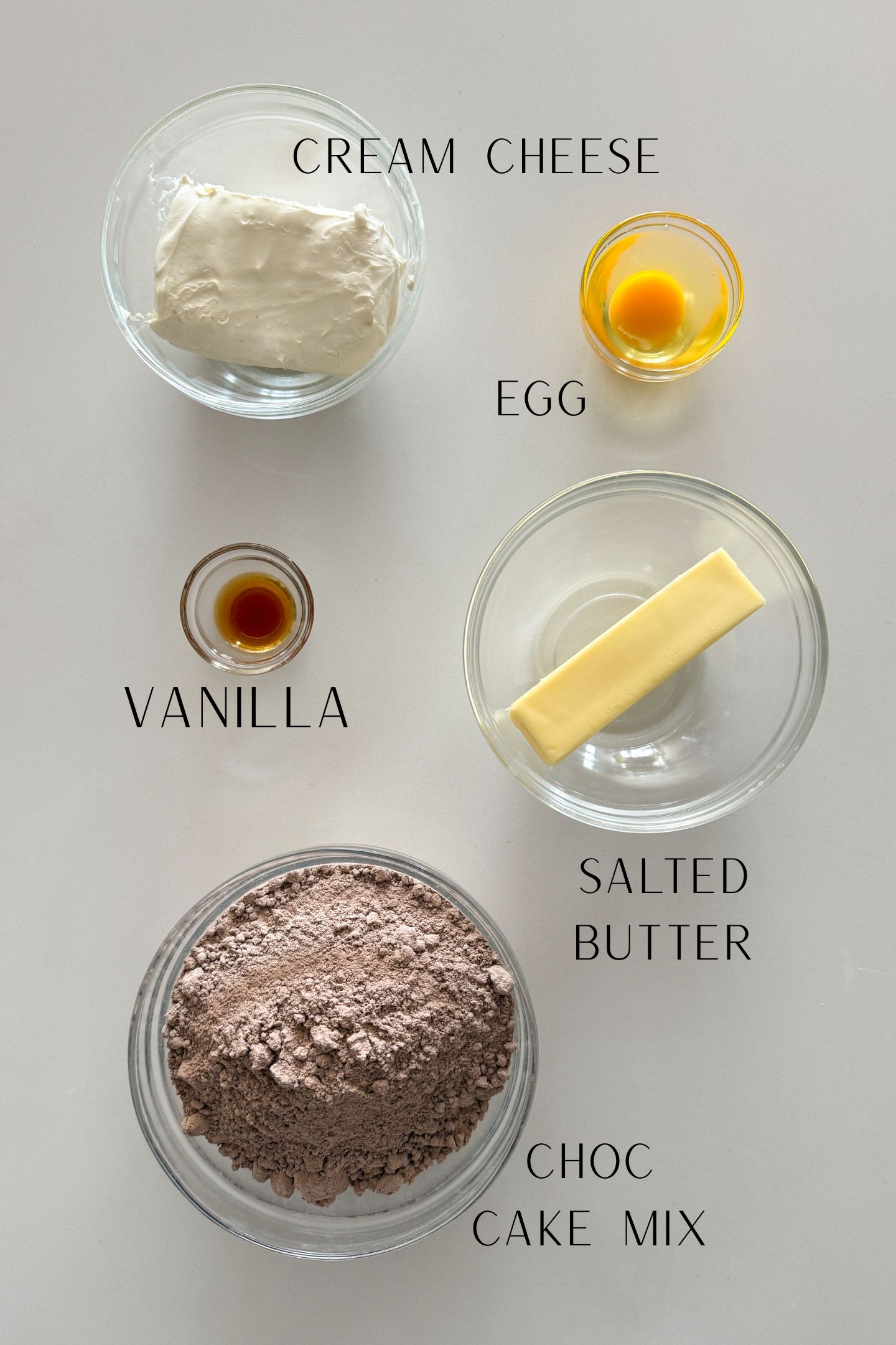Ingredients measured out in bowls to make the chocolate cake mix and cream cheese cookies.