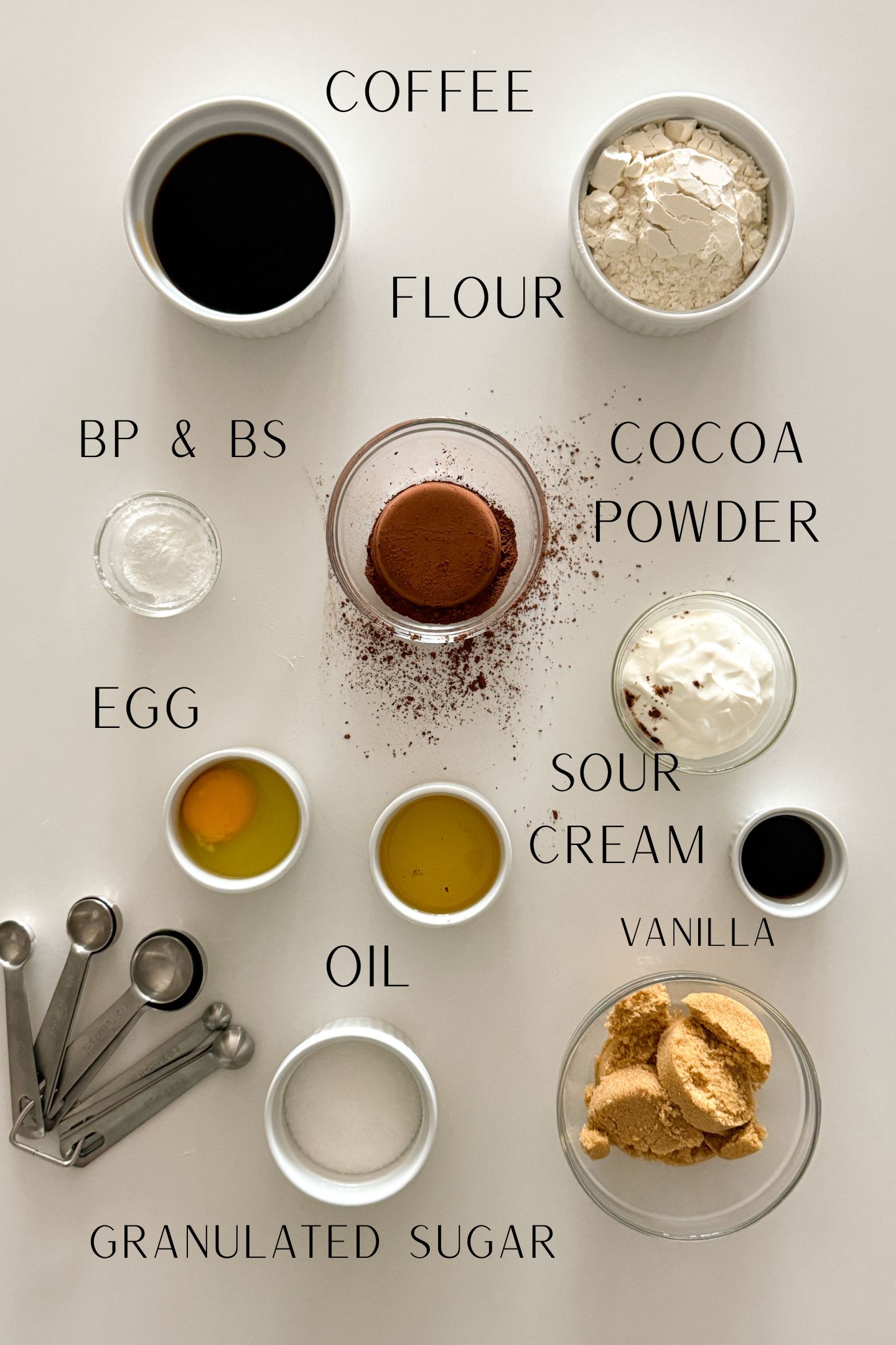 Ingredients measured out in bowls to make a moist cookies and cream cake.