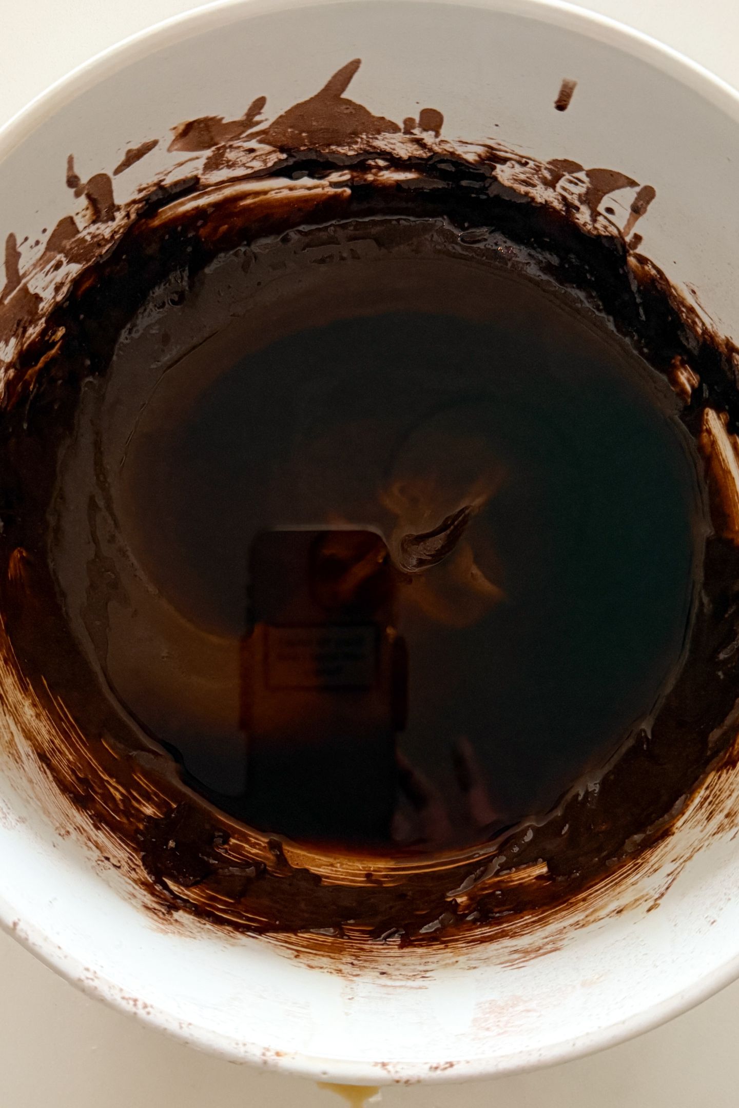 Adding hot coffee to the batter.