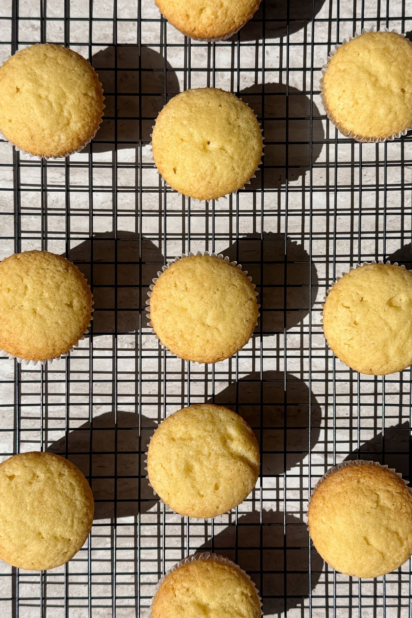 Baked cupcakes on a cooling rack.