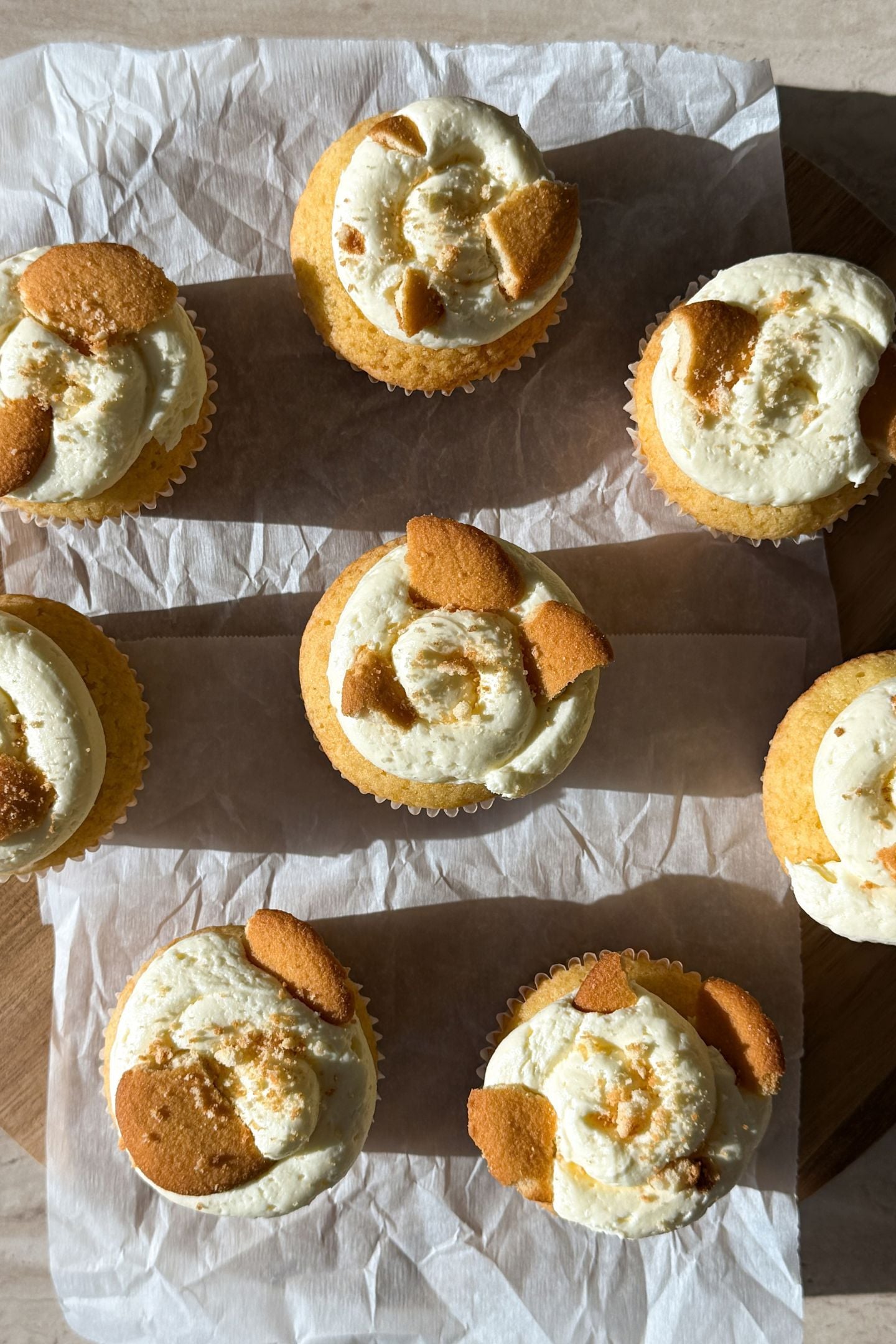 Banana pudding cupcakes topped with banana pudding buttercream and crushed vanilla wafer cookies.