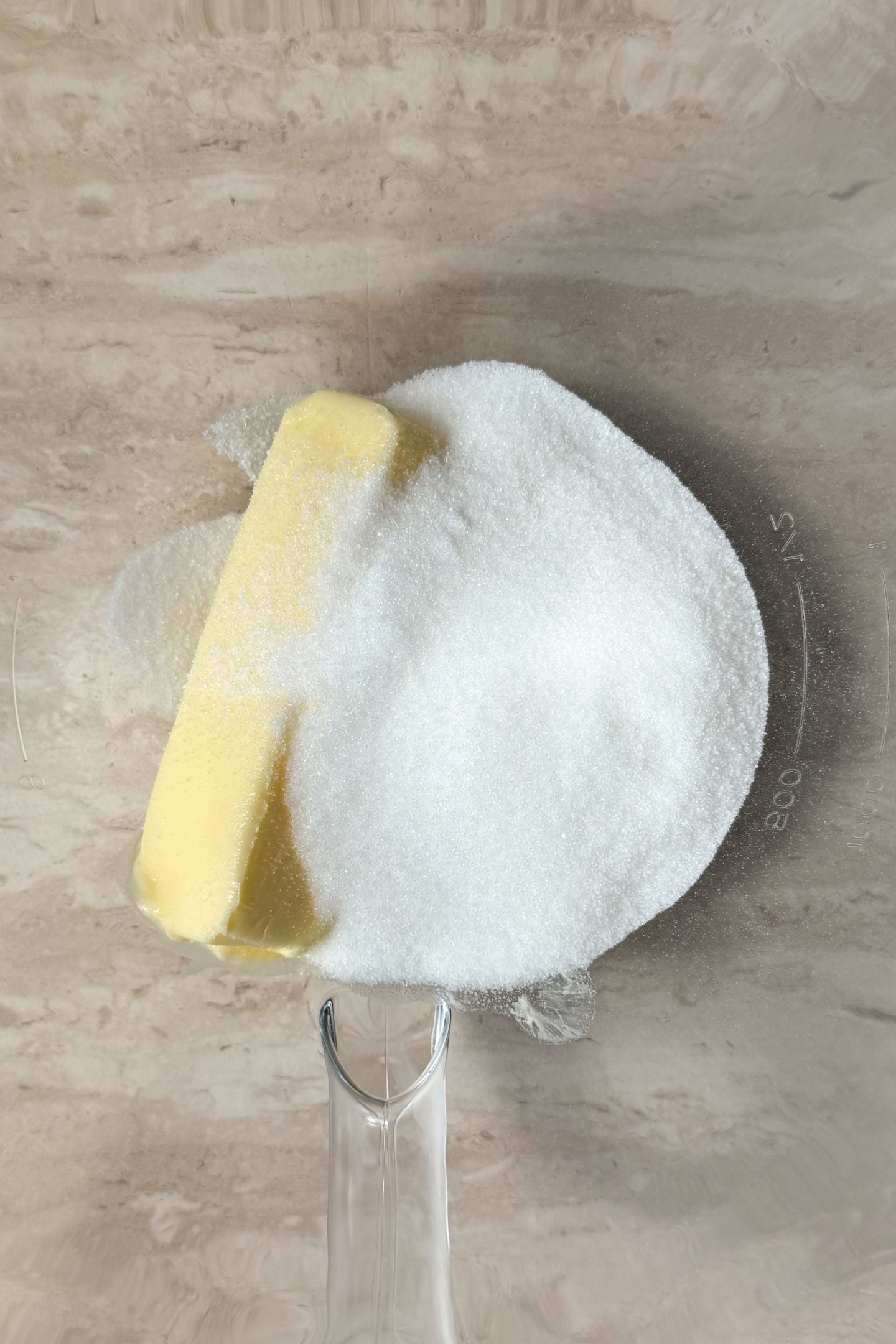Butter and sugar in a mixing bowl.