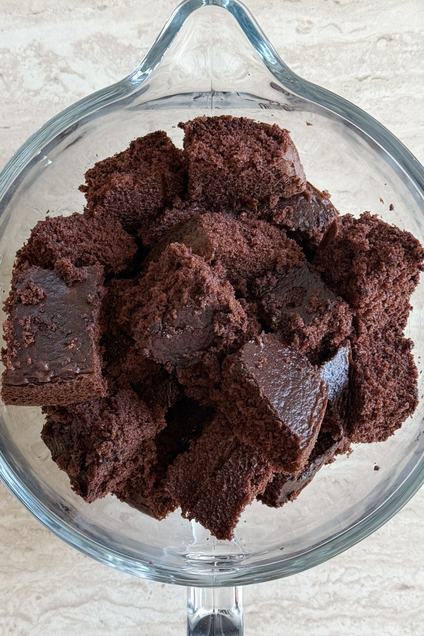 Baked and cooled cake in a mixing bowl.