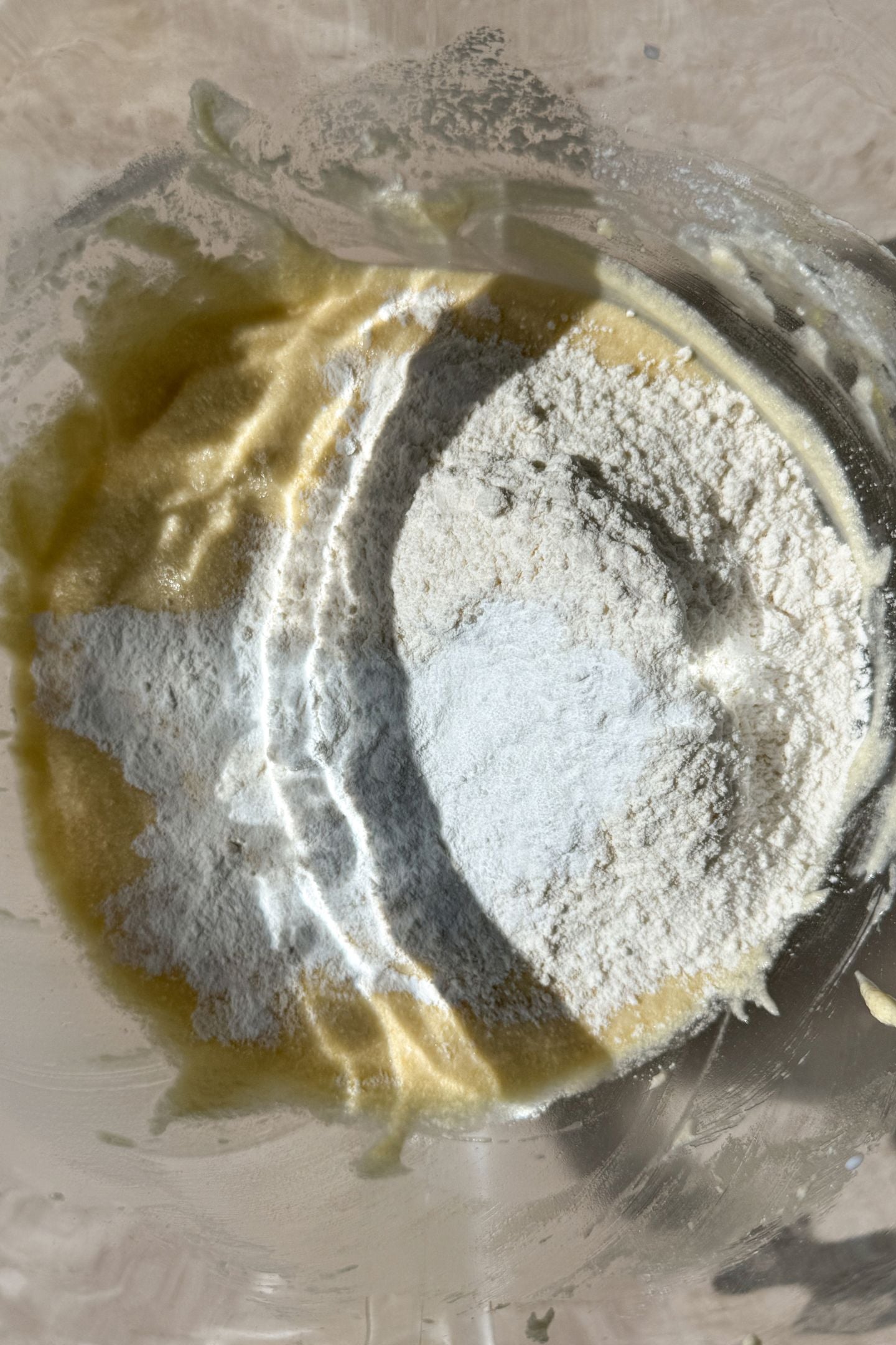 Adding the remaining flour and dry ingredients to the batter.