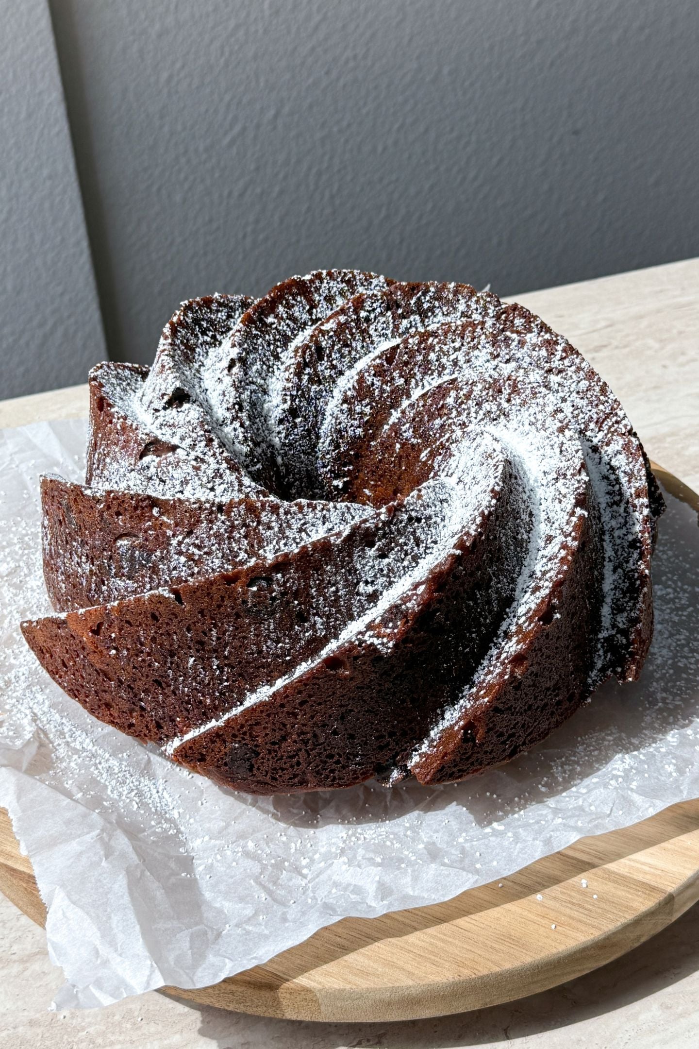 Banana chocolate chip bundt cake dusted in powdered sugar.